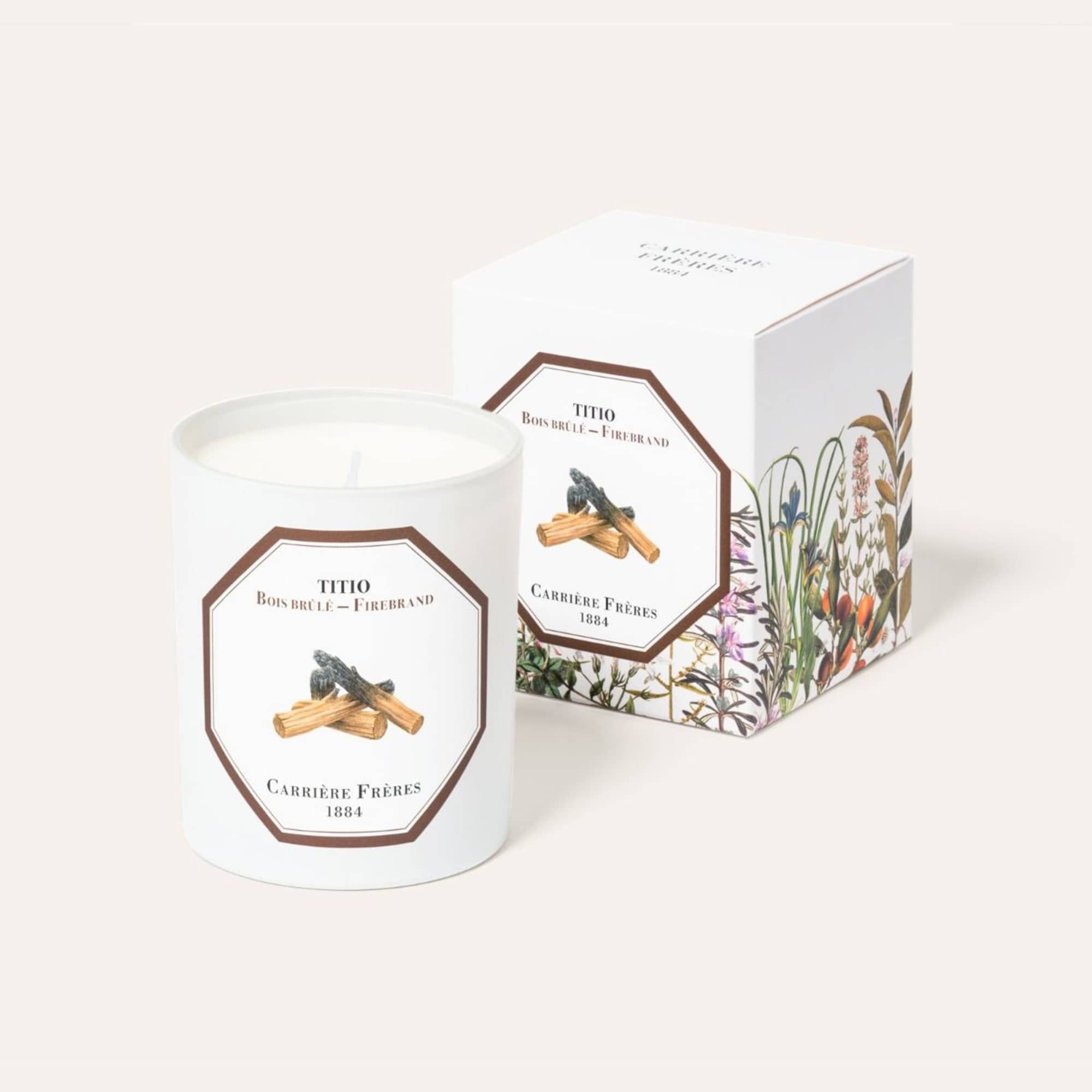 White scented candle in a glass jar with matching box