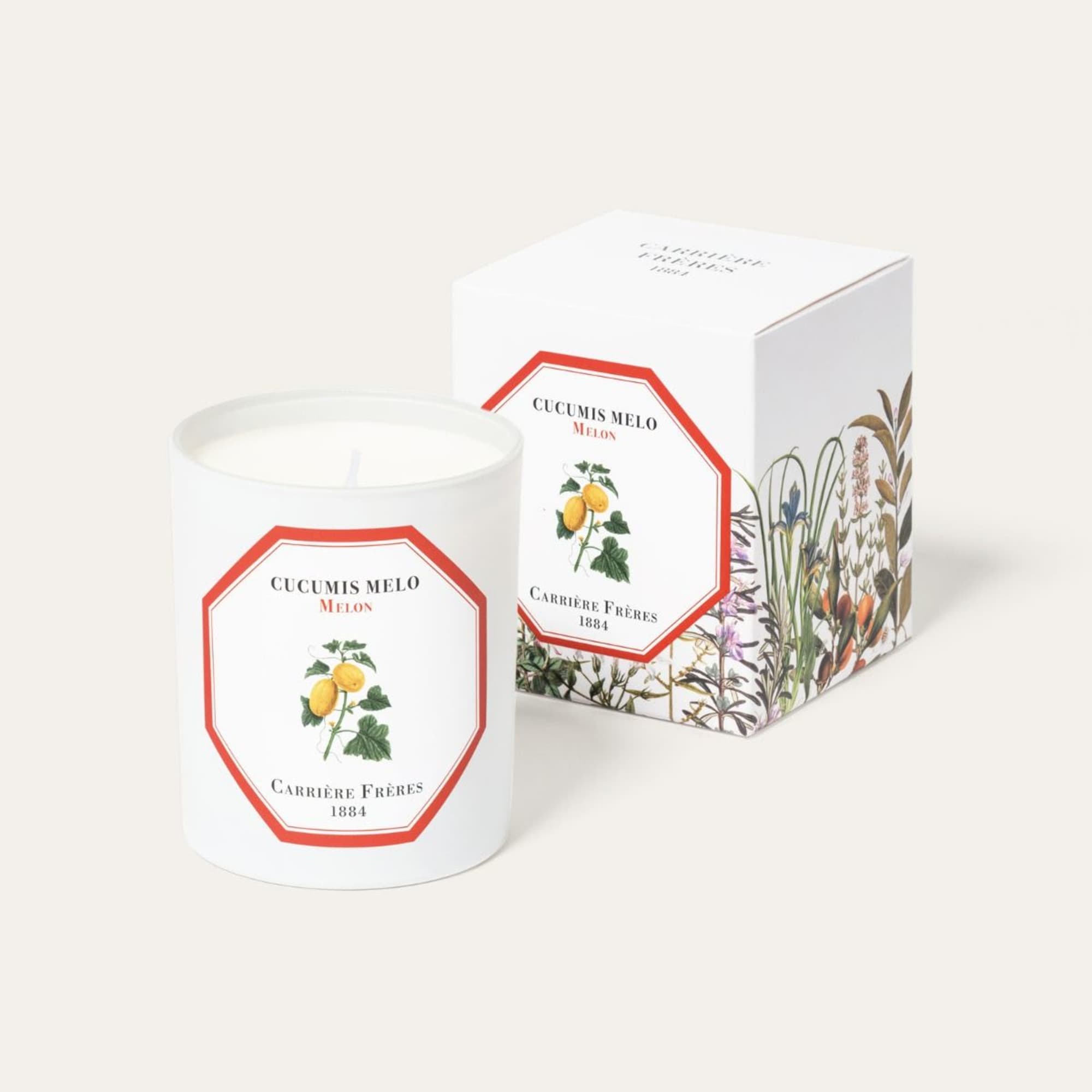 White candle in a glass jar with matching box