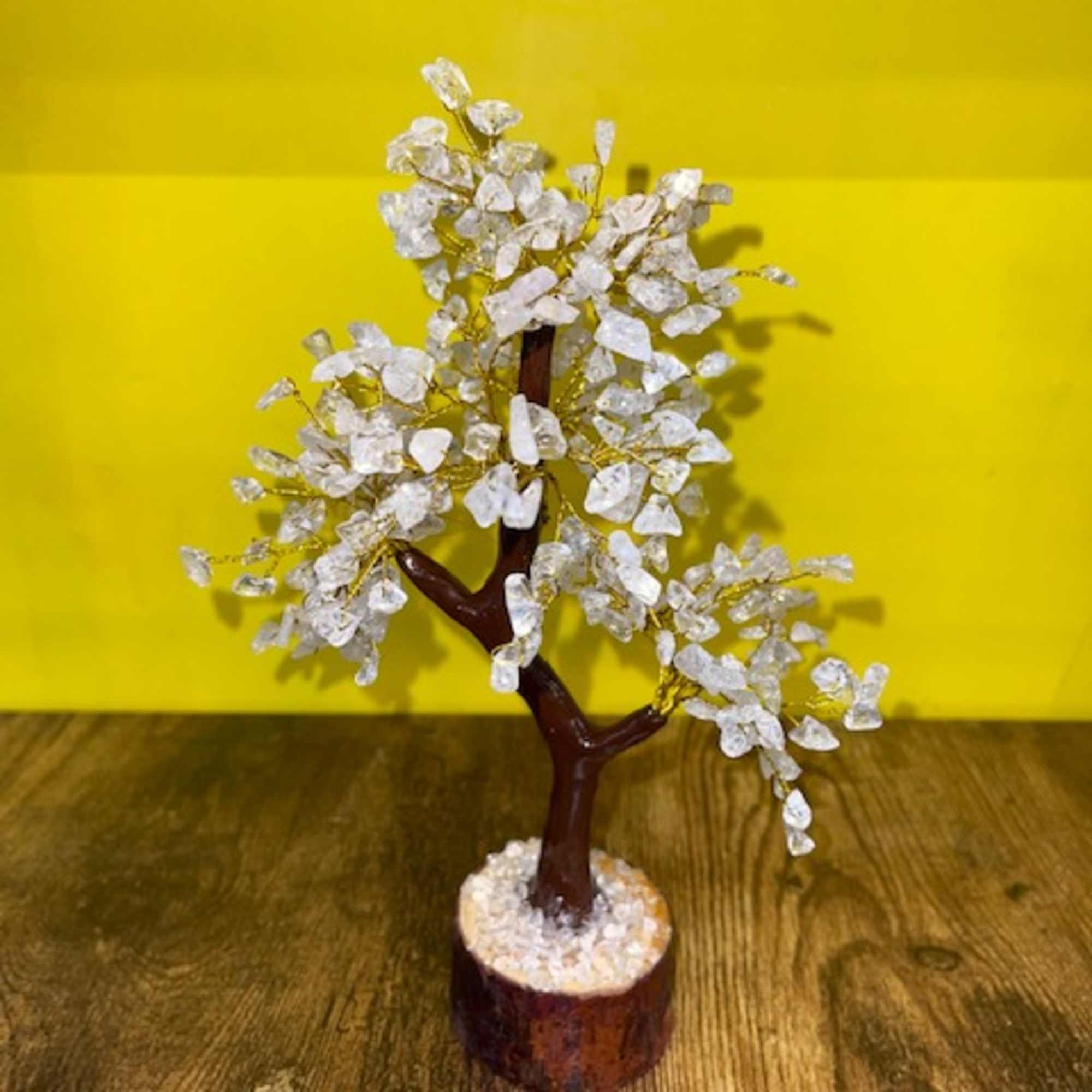 Decorative crystal tree sculpture on a wooden base