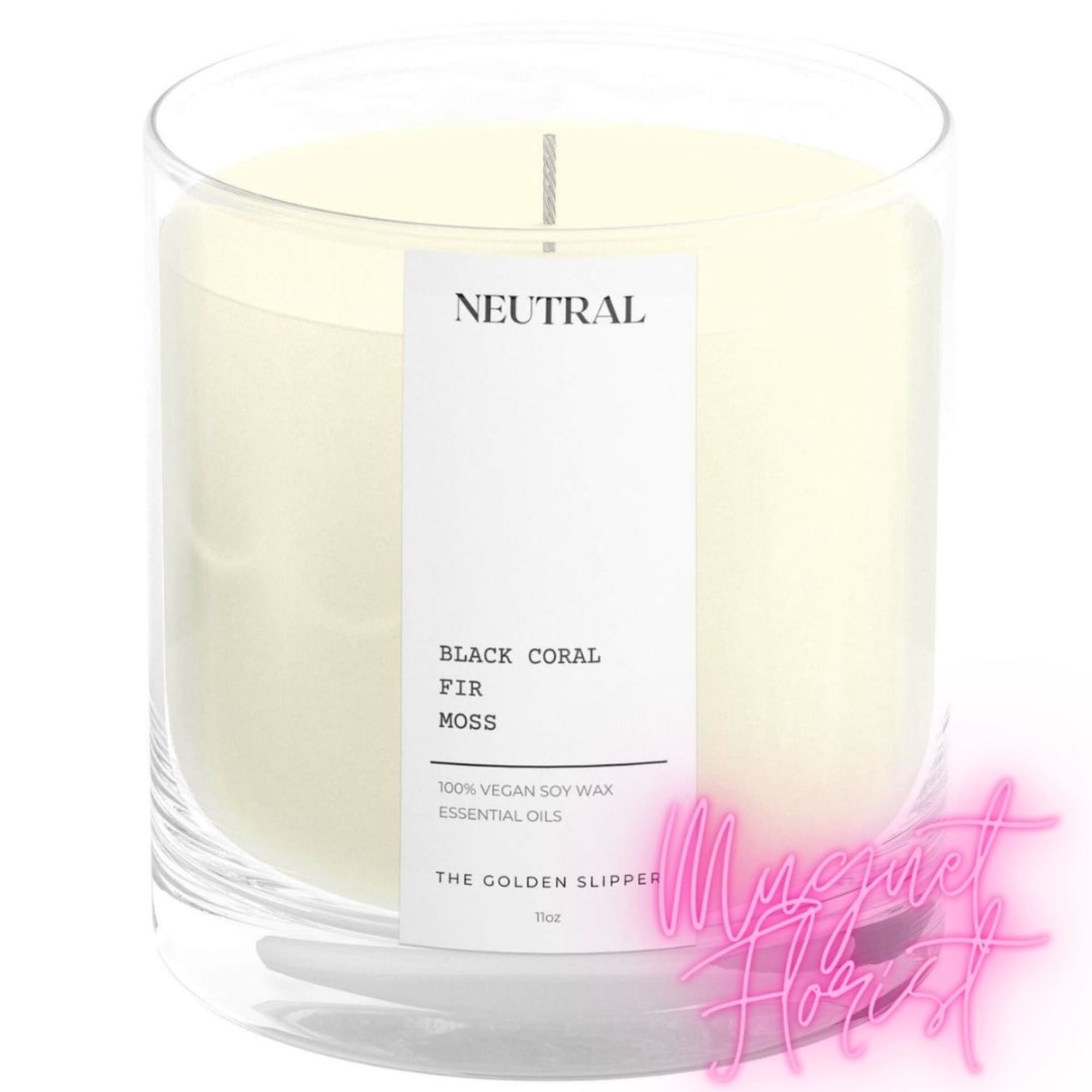 Cream-colored candle in a clear glass jar with a label