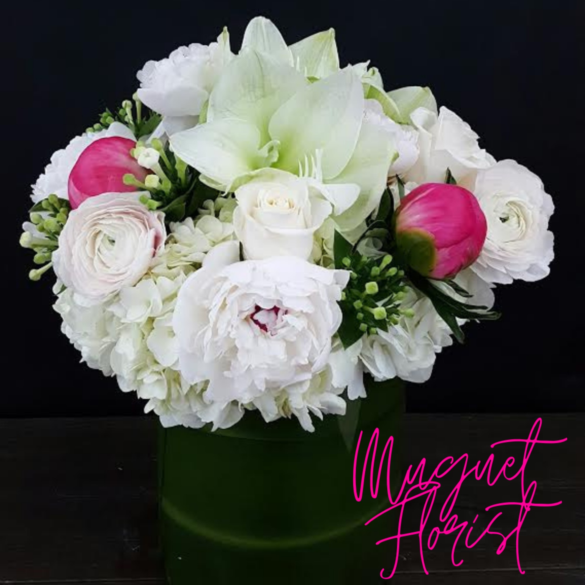 White and pink bouquet in a green box