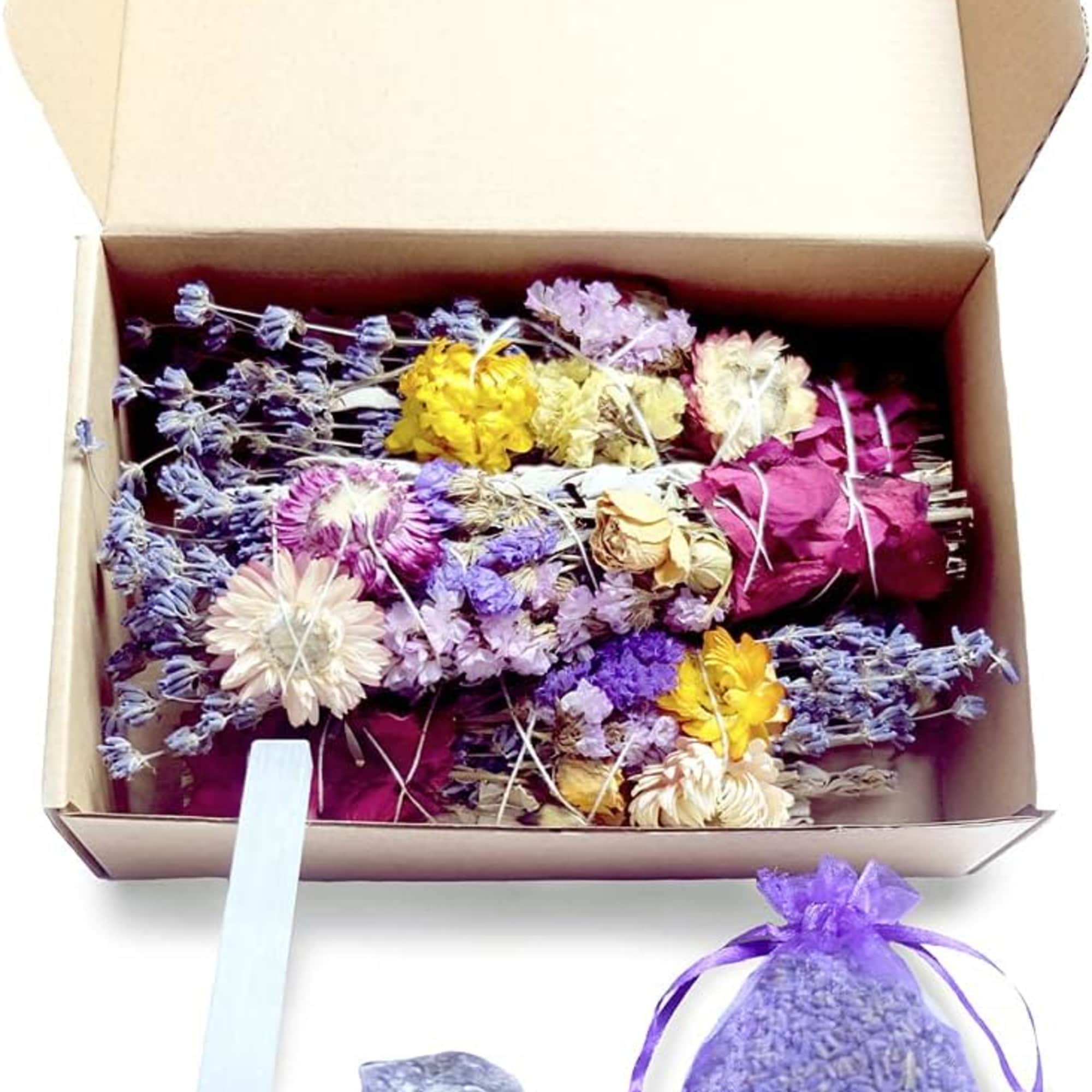 Box of dried flowers with a lavender sachet and crystal wand