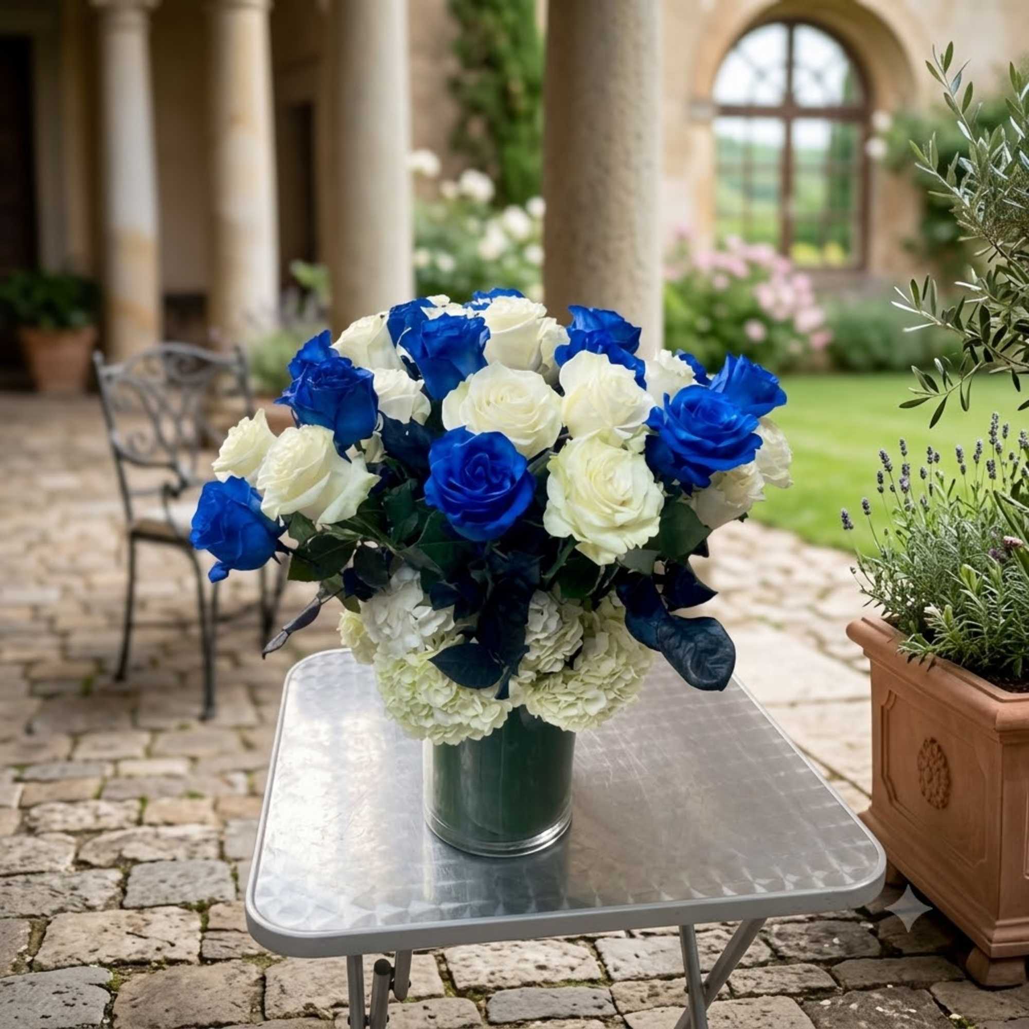 Blue and white roses arranged in a glass vase