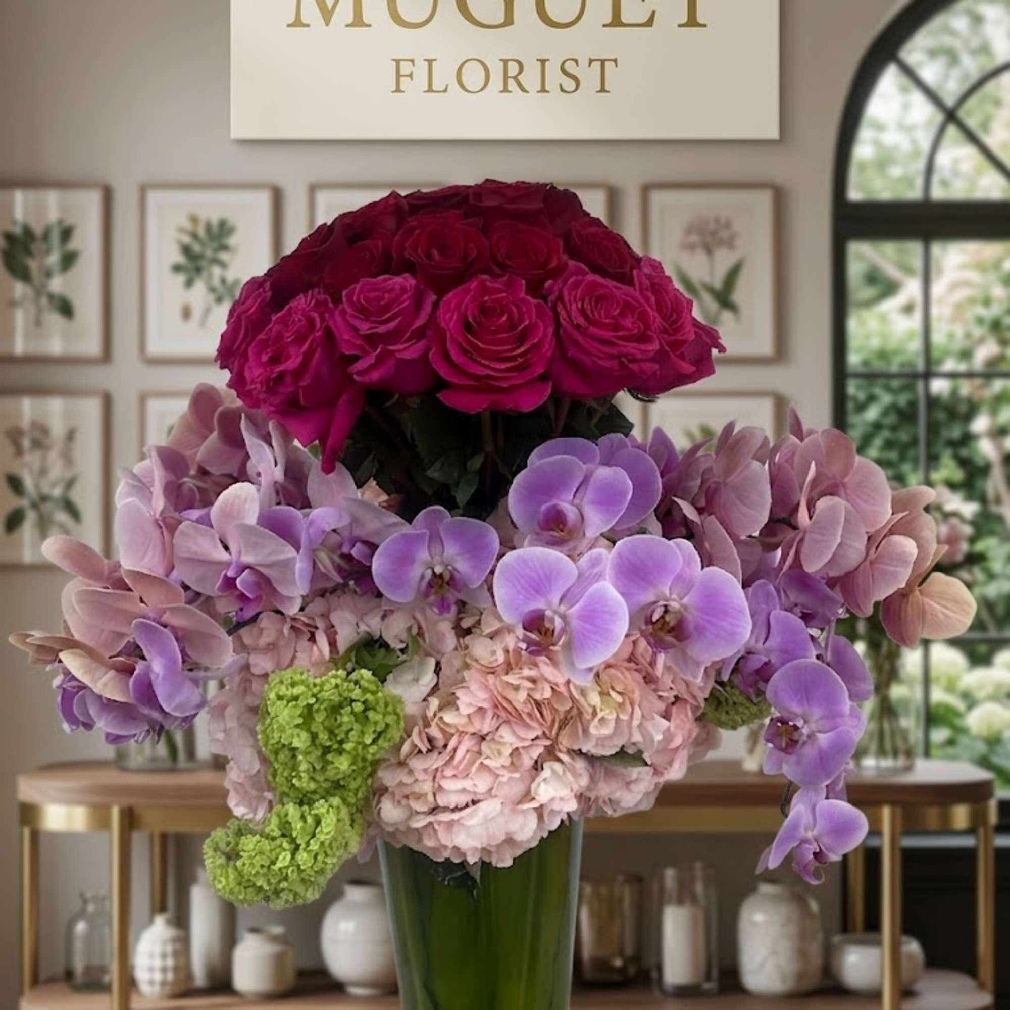 Tall vase arrangement with magenta roses, lavender orchids, and pale pink hydrangeas