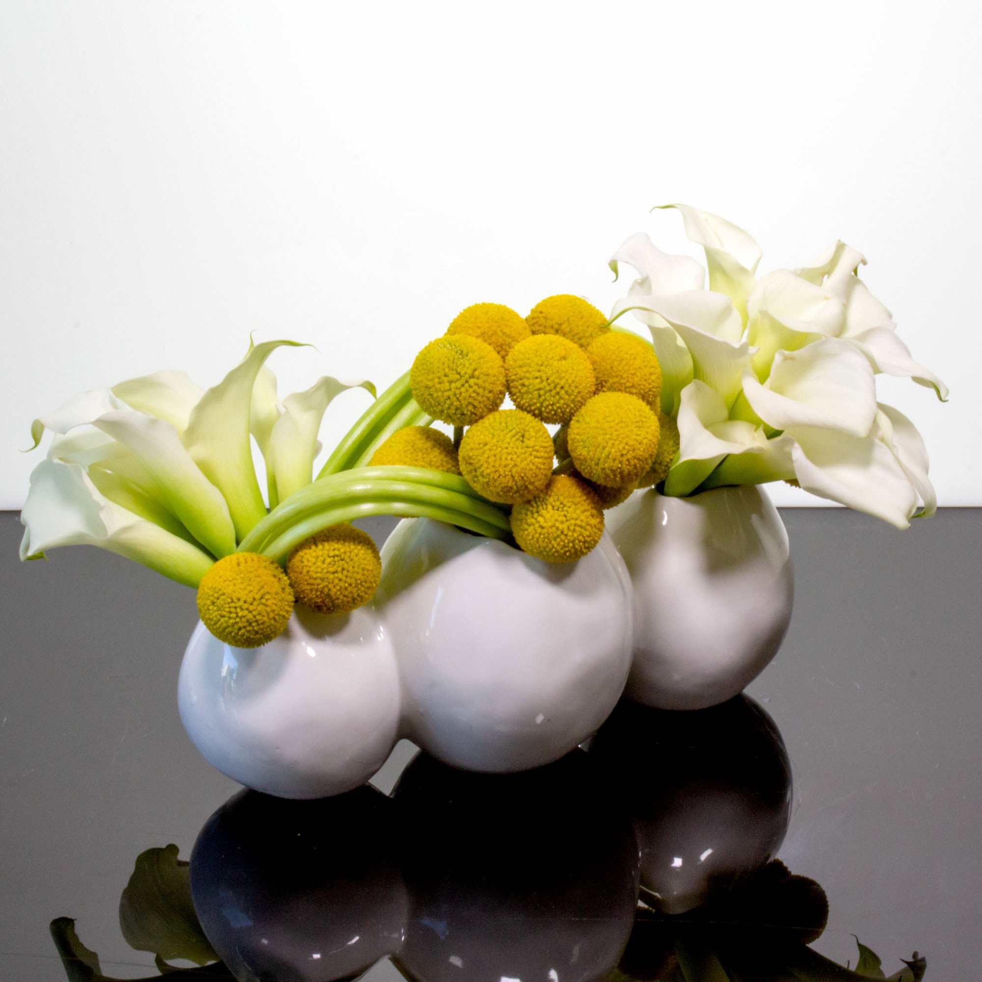 A modern floral sculpture of 20 stems of white Calla Lilies and, photo 3 of 3