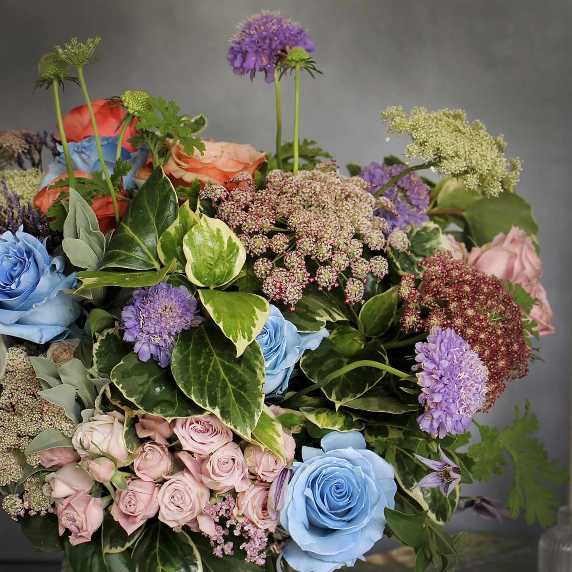 "Quirky" is a unique arrangement filled with various florals in a simple, photo 4 of 4