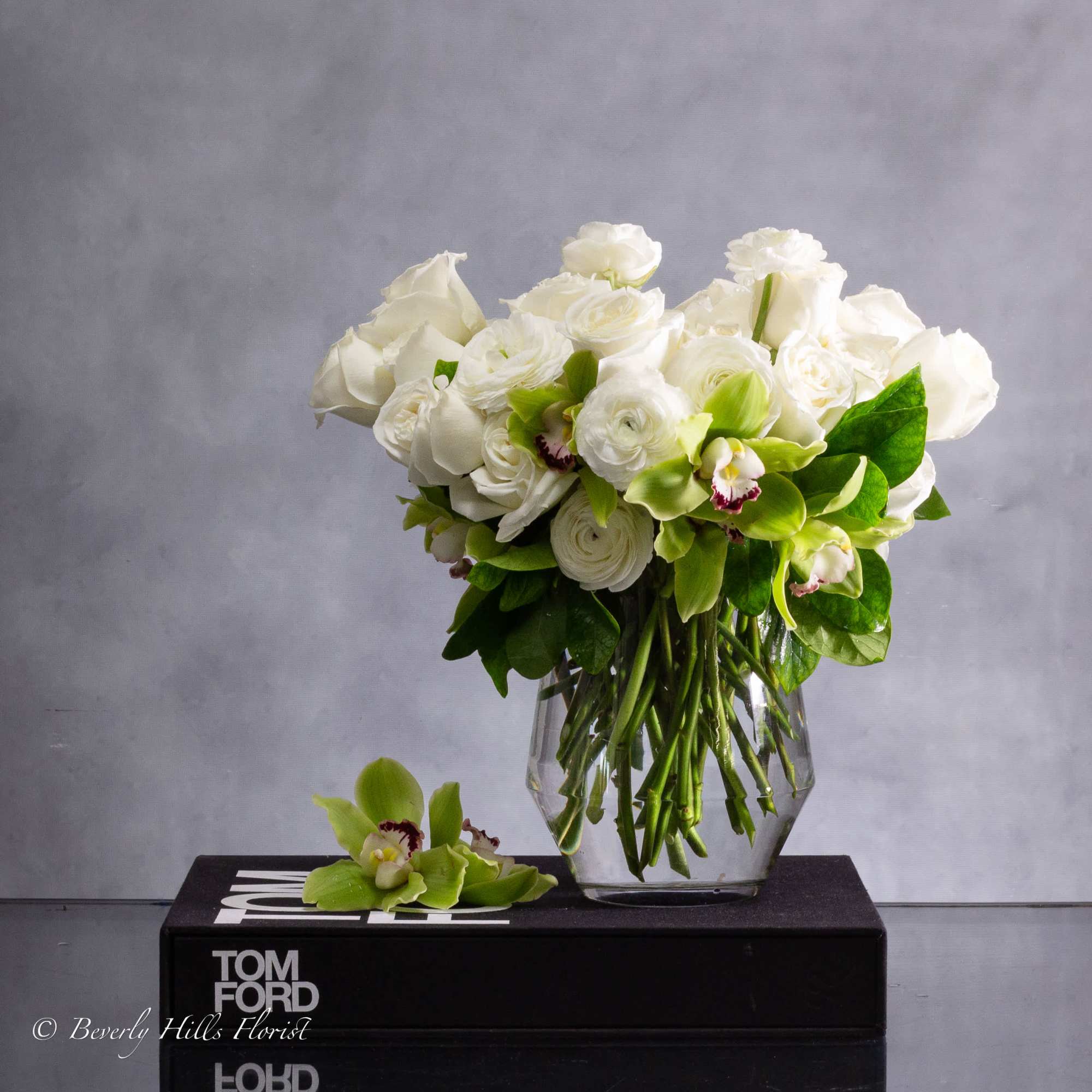Embrace timeless elegance with our Green and White Classic Look floral arrangement.