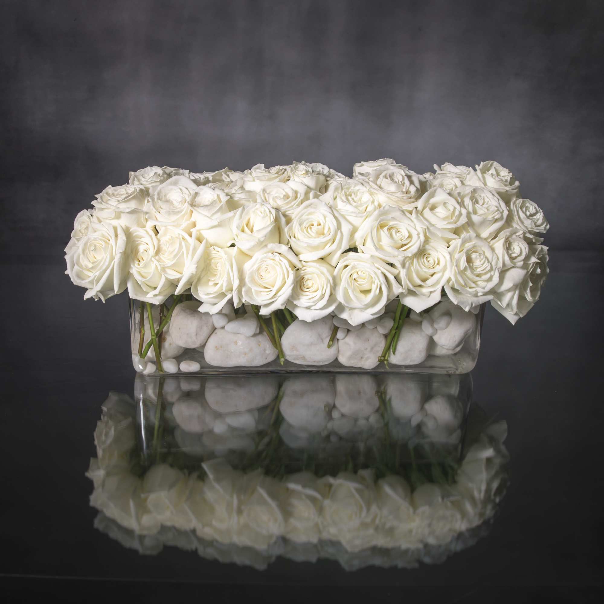This sophisticated design features 100 Creamy White Roses set in a rectangular