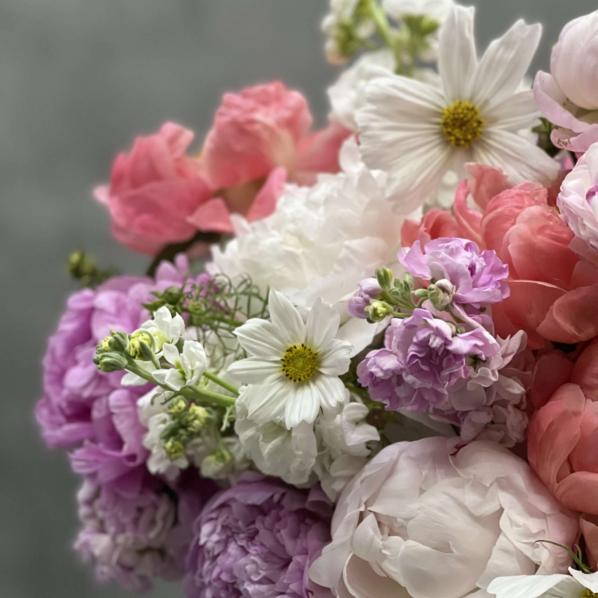 This pedestal glass vase bursts with bloom upon bloom of gorgeous pinks, photo 2 of 2