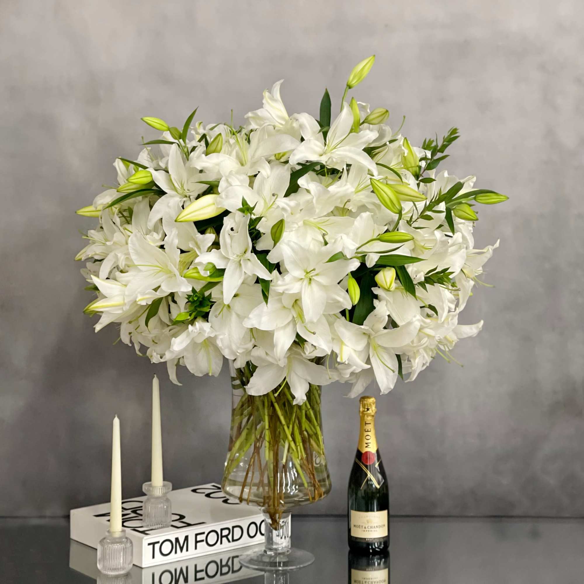 An arrangement that is made with 50 stems of Casablanca Lillies. A, photo 3 of 4
