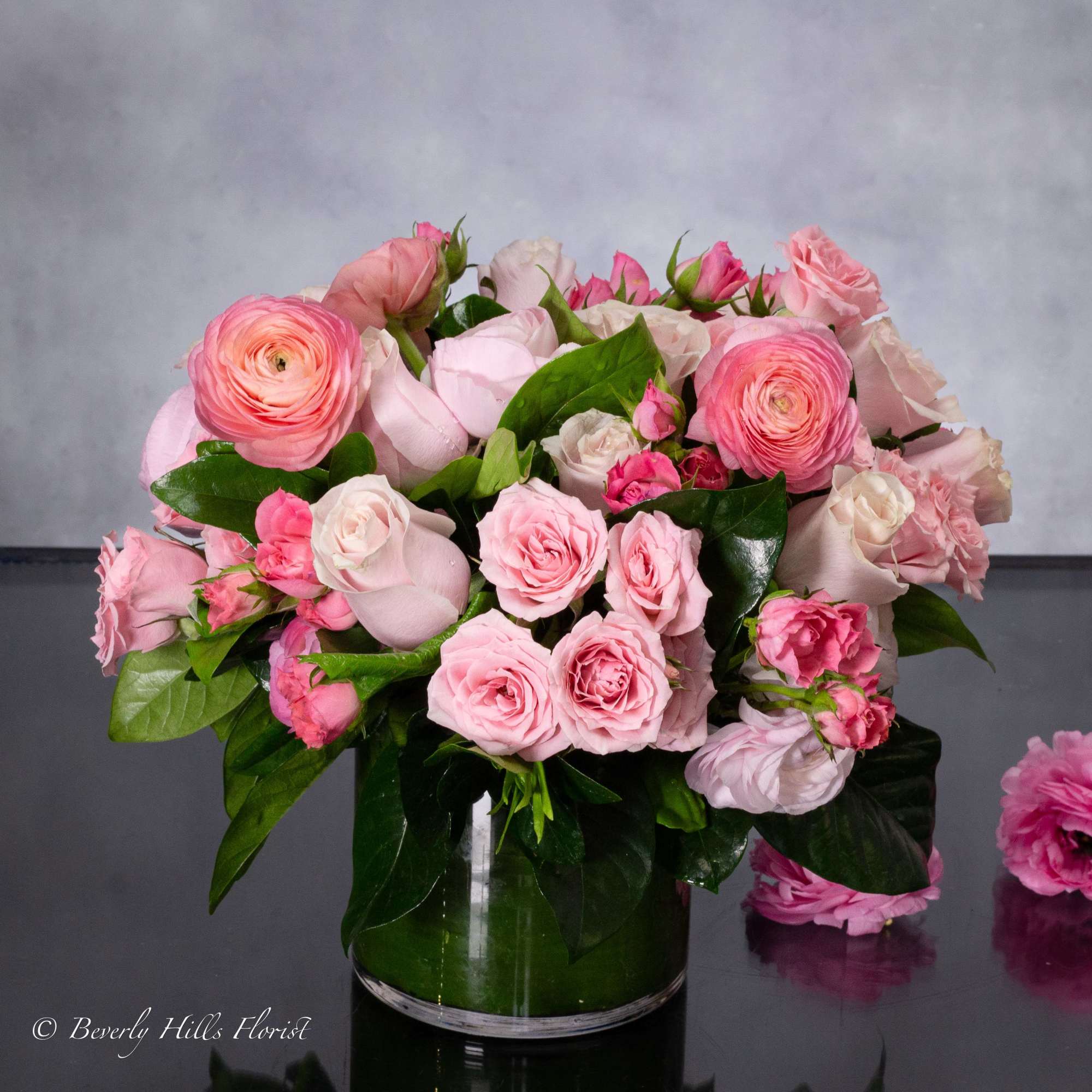 A stunning blend of pinks, creams, and touches of greens are combined