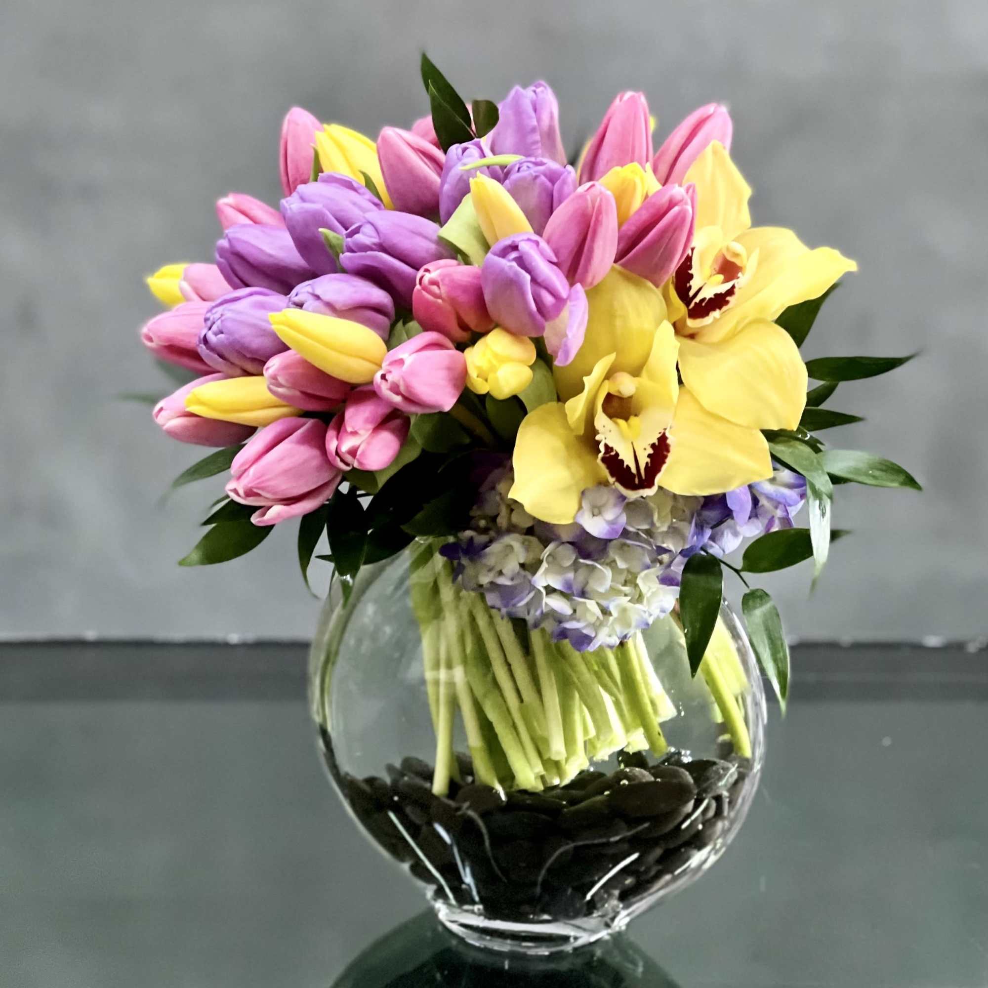 Here's a spring-tastic way to brighten someone's day: a glass vase of