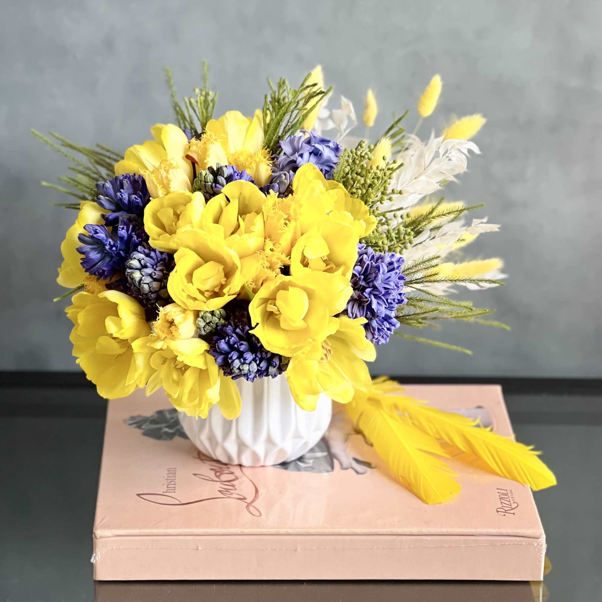 50 vibrant, fresh tulips and a single Orchid bloom in a variety