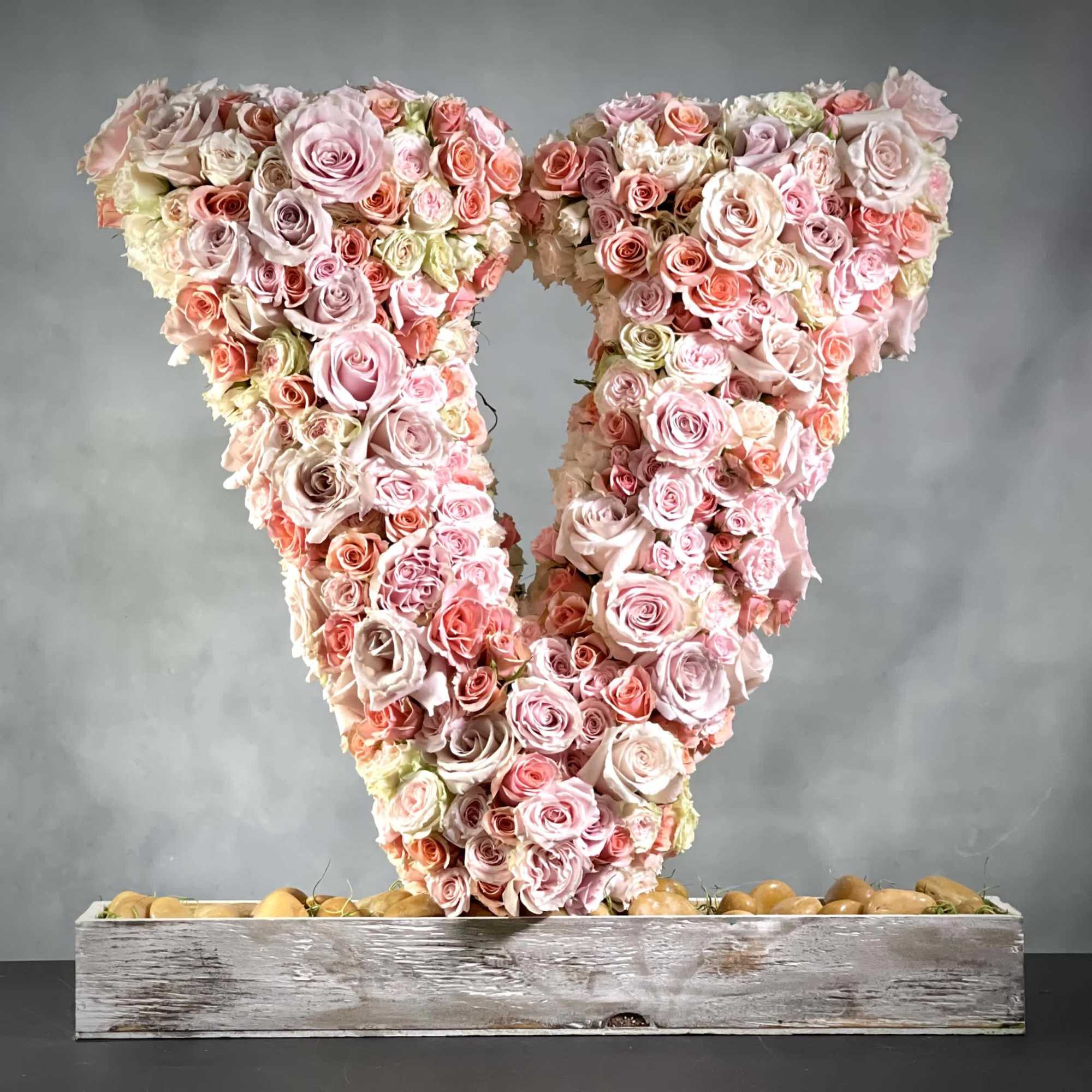 V for Va Va Voom.  Approximately 30" tall. Variety of size