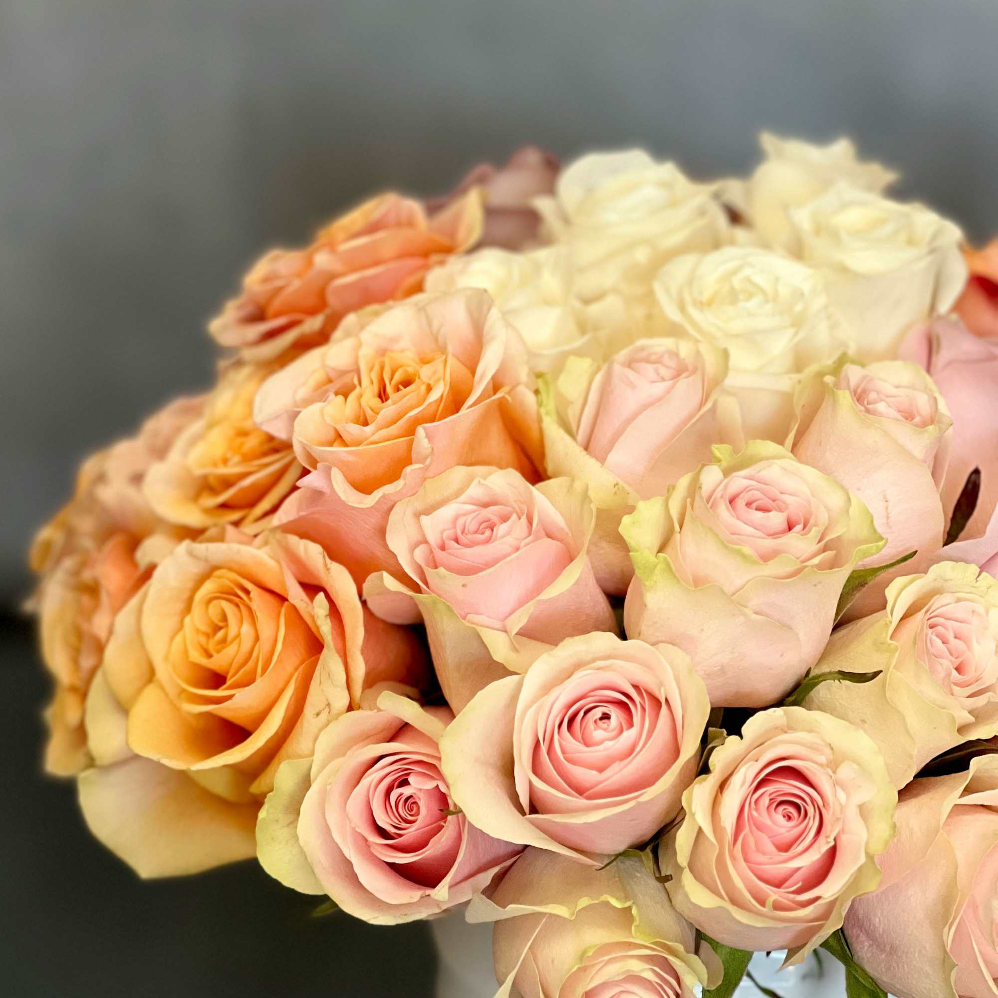 A sensational floral presentation arranged in a white vase. Luscious pastels featuring, photo 2 of 3