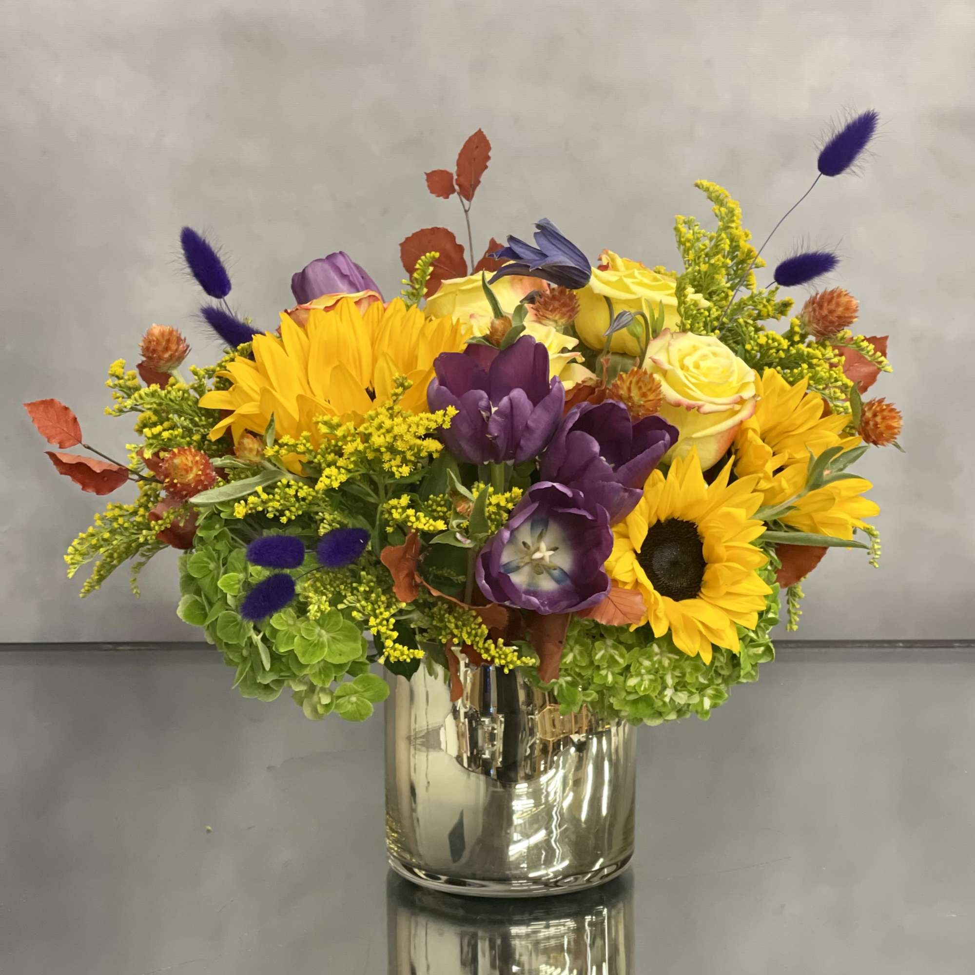 Deliver happiness with this abundant fall floral including sunflower, tulips, roses and, photo 2 of 3