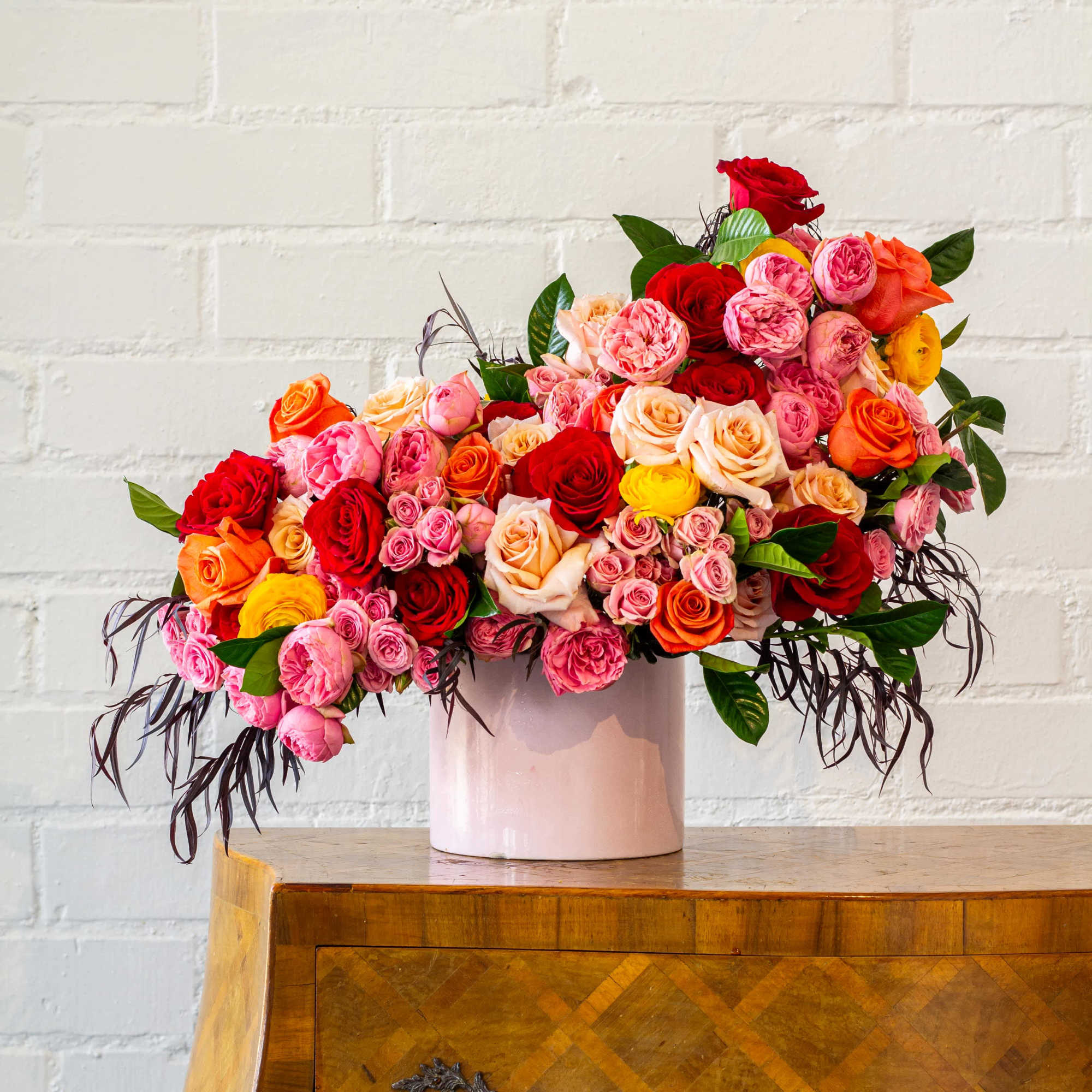 The "Let's Stay Together" floral arrangement bursts with colorful roses, garden roses, photo 2 of 4