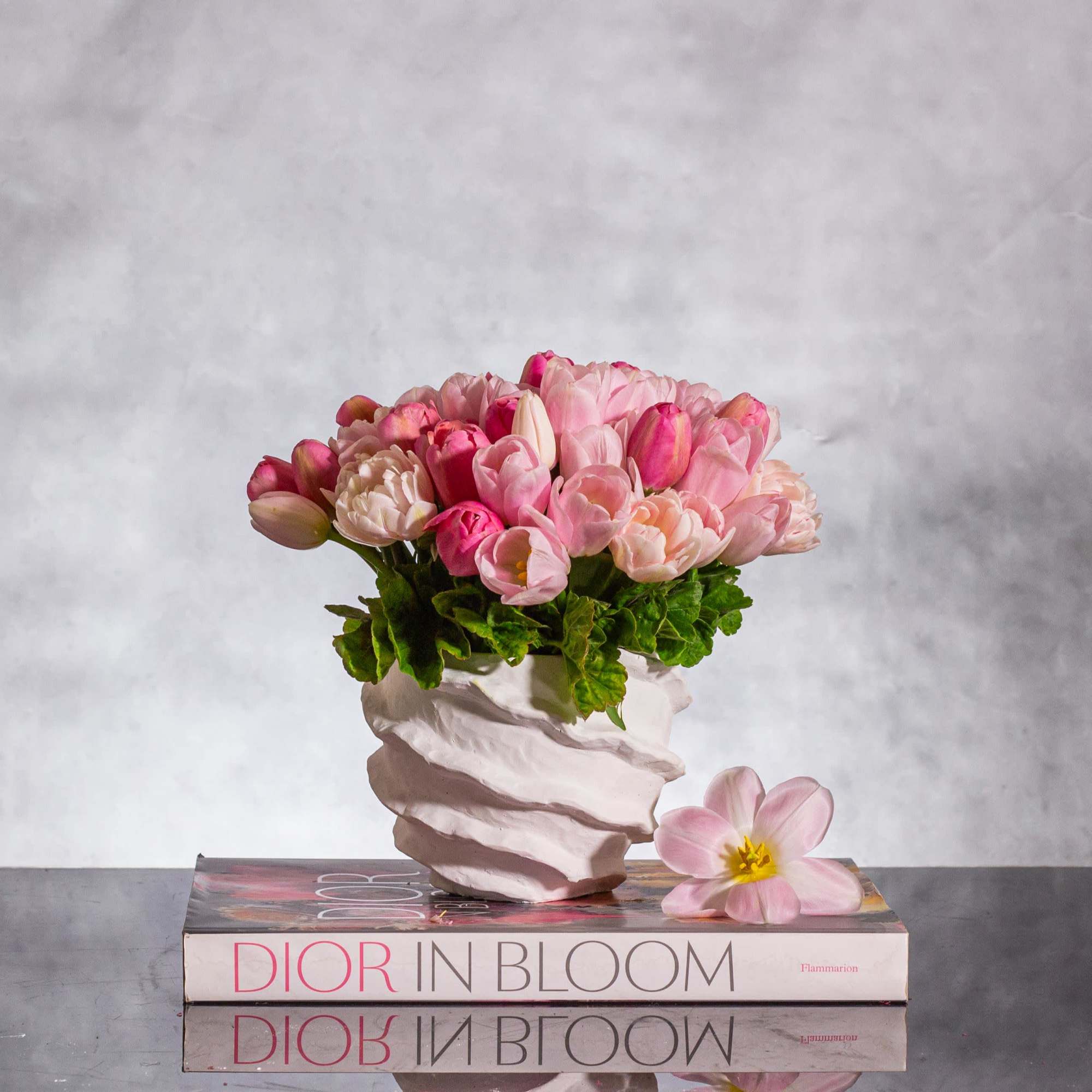Embrace the essence of spring with our exquisite arrangement featuring 50 pink