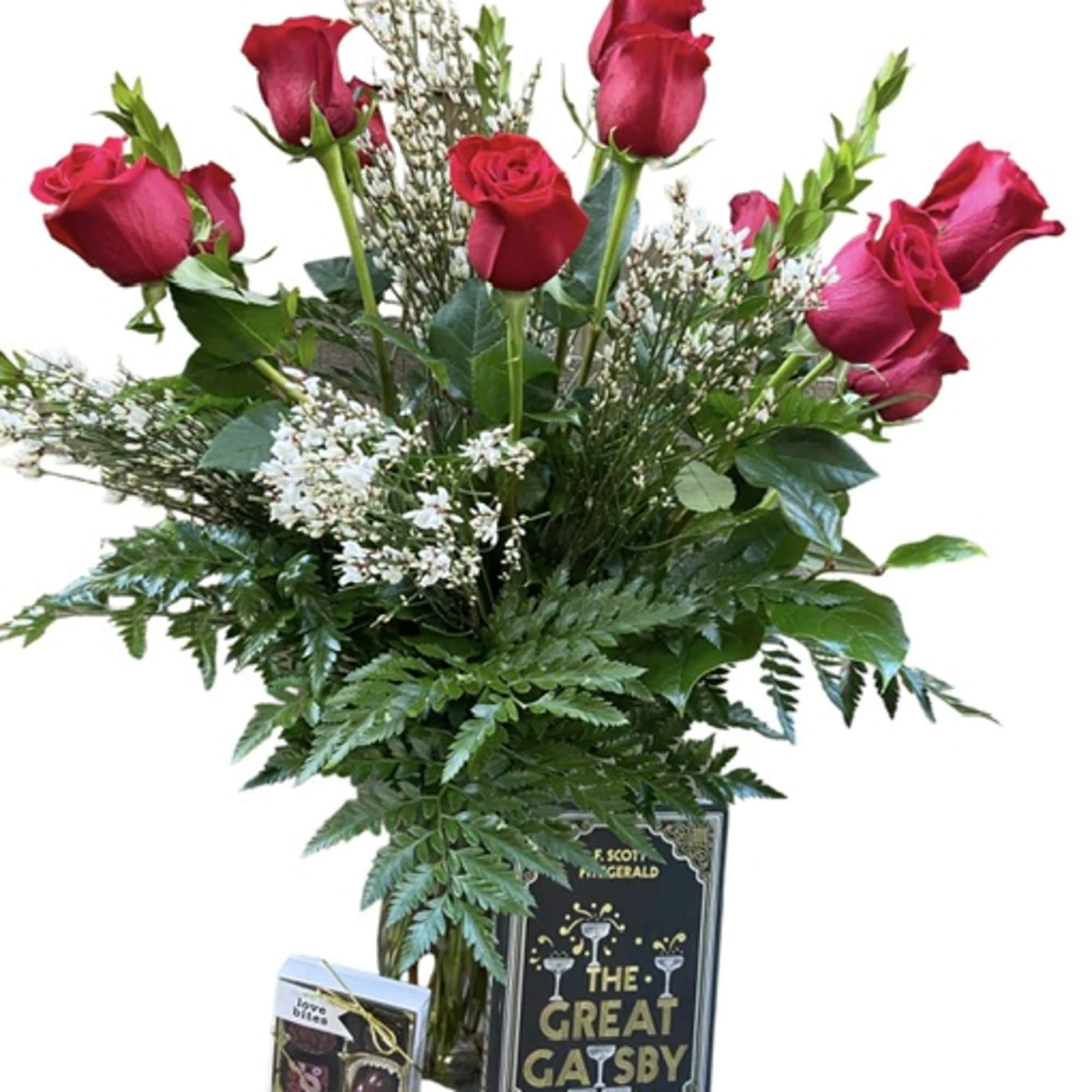Bouquet of red roses with greenery and a book-shaped gift box
