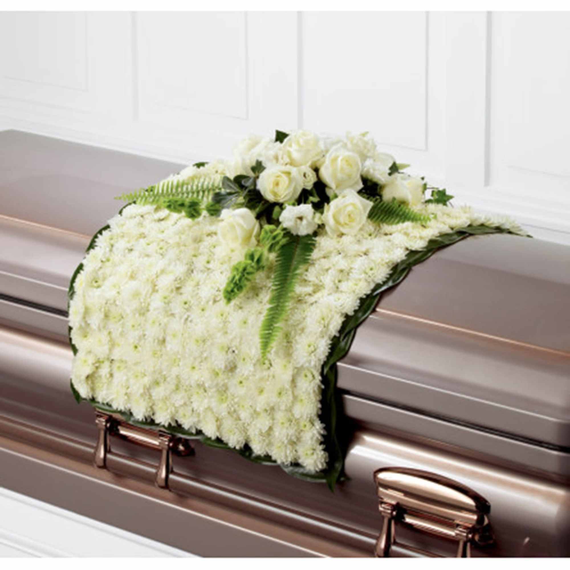 White floral casket spray with roses and chrysanthemums