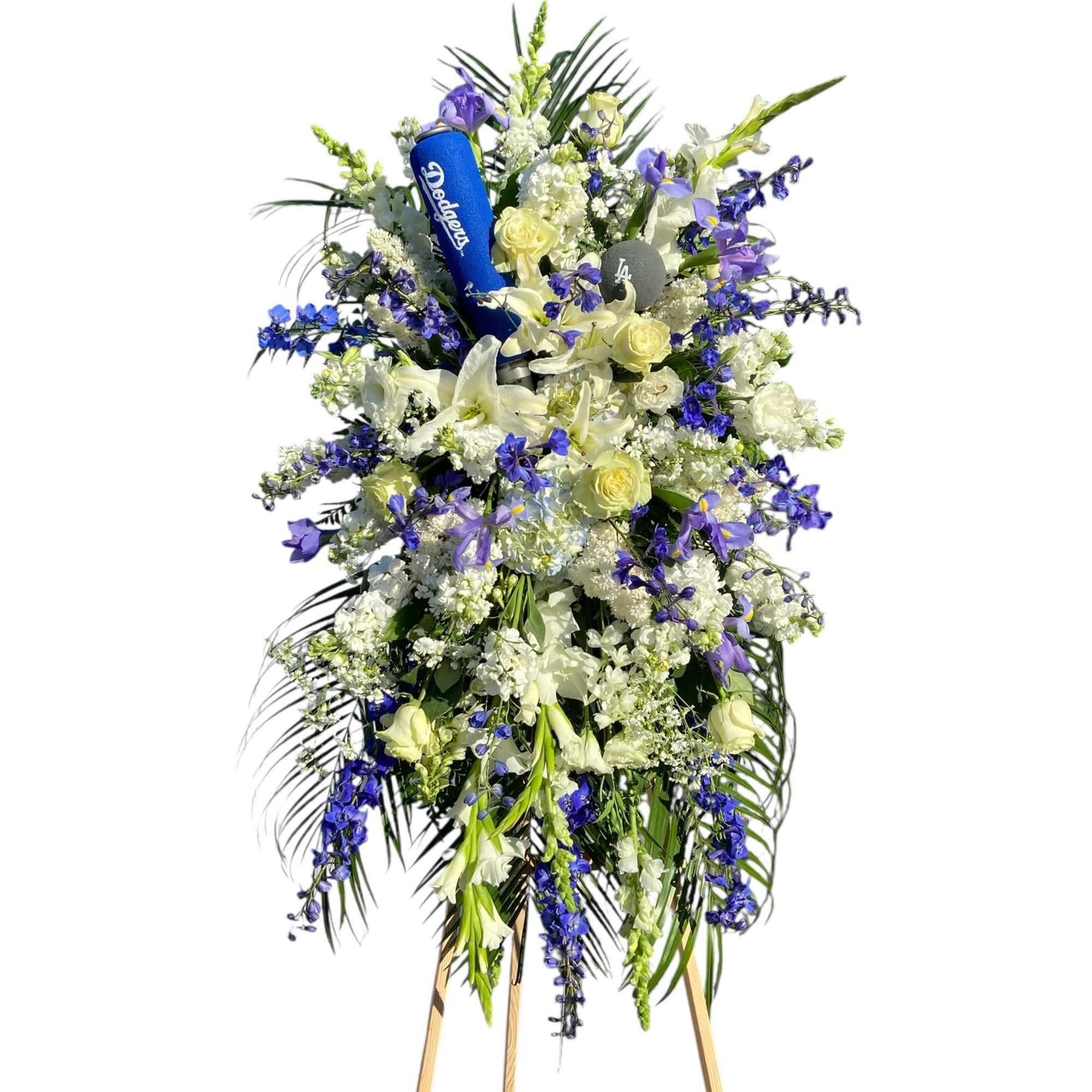 Tall funeral spray with white and blue flowers on a stand