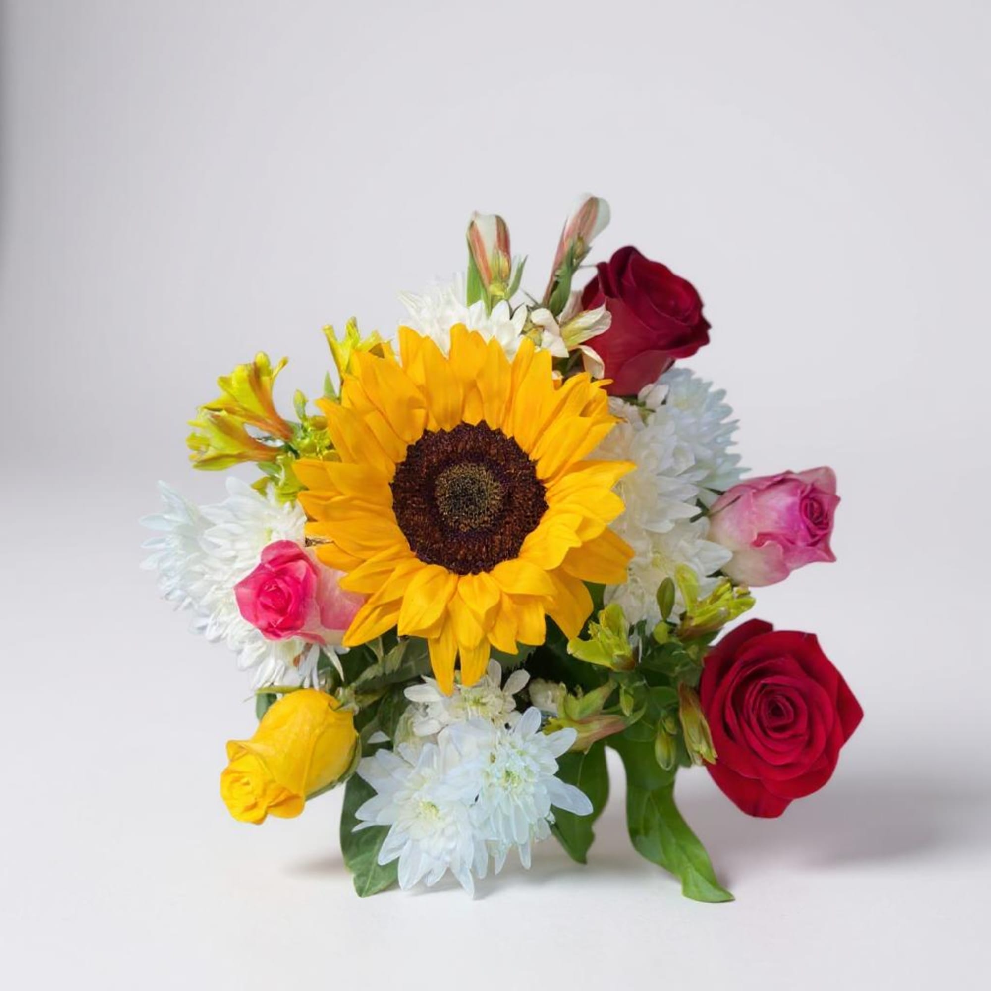 Bouquet with a sunflower, red roses, and white daisies