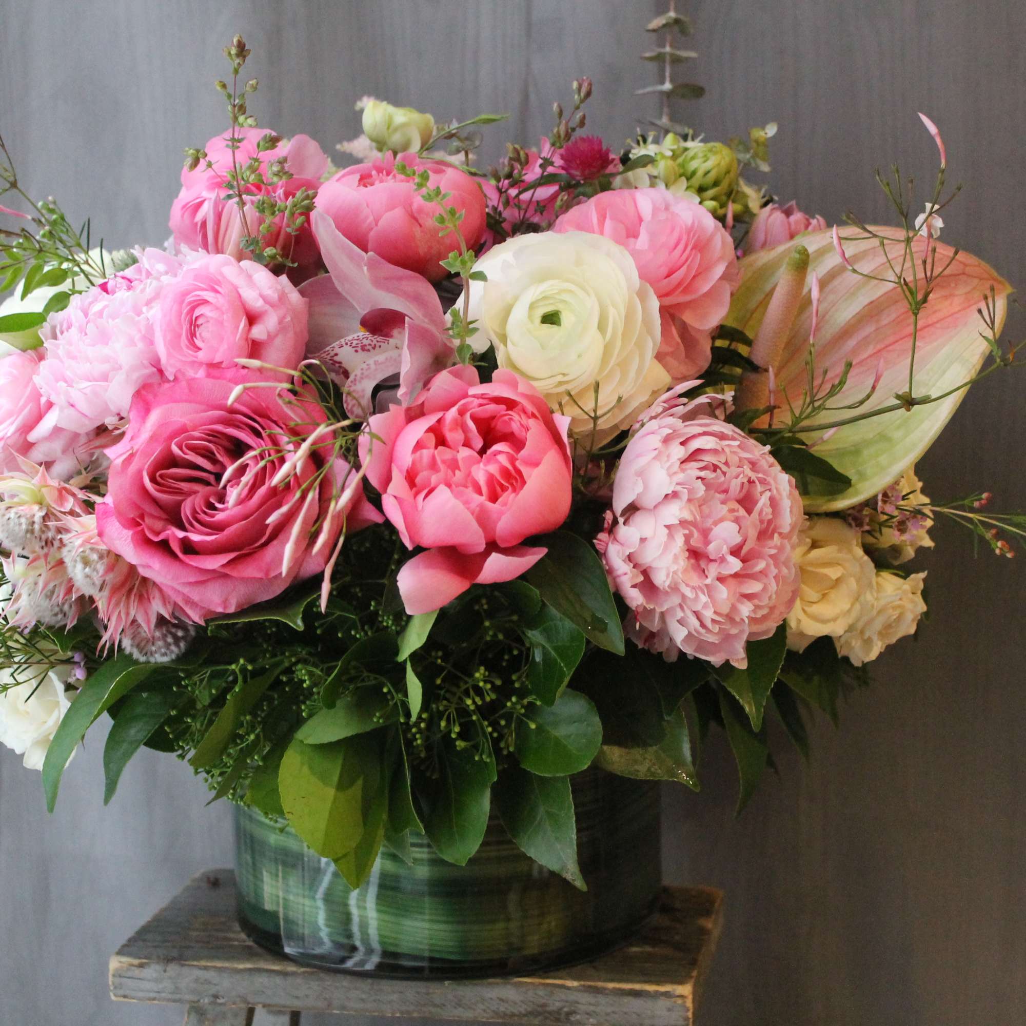 The most luxurious blooms in low clear vase. Filled with peonies, roses