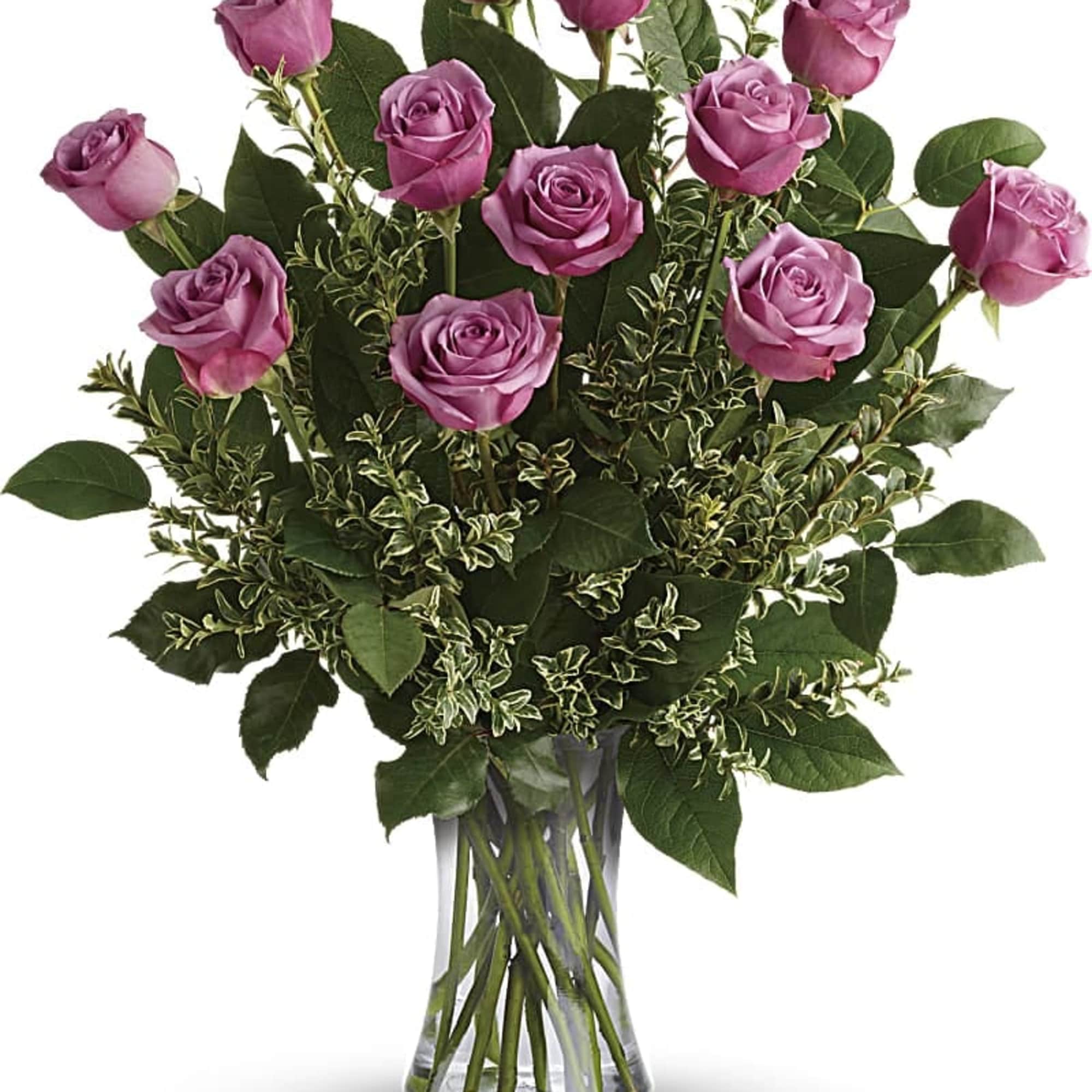 Pink roses arranged in a clear glass vase