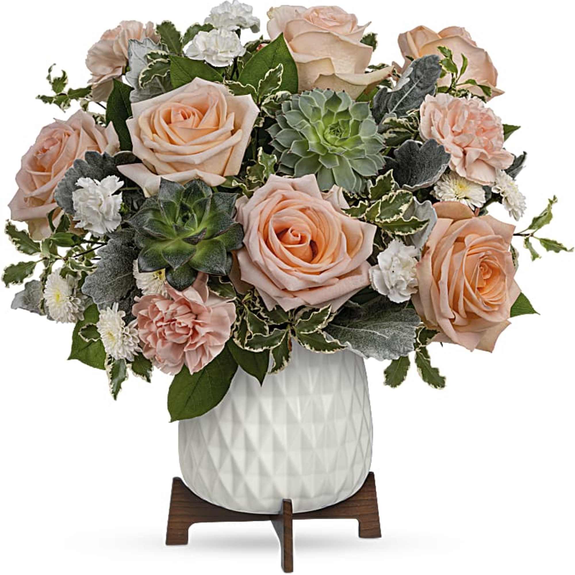 Peach roses and succulents arranged in a white vase