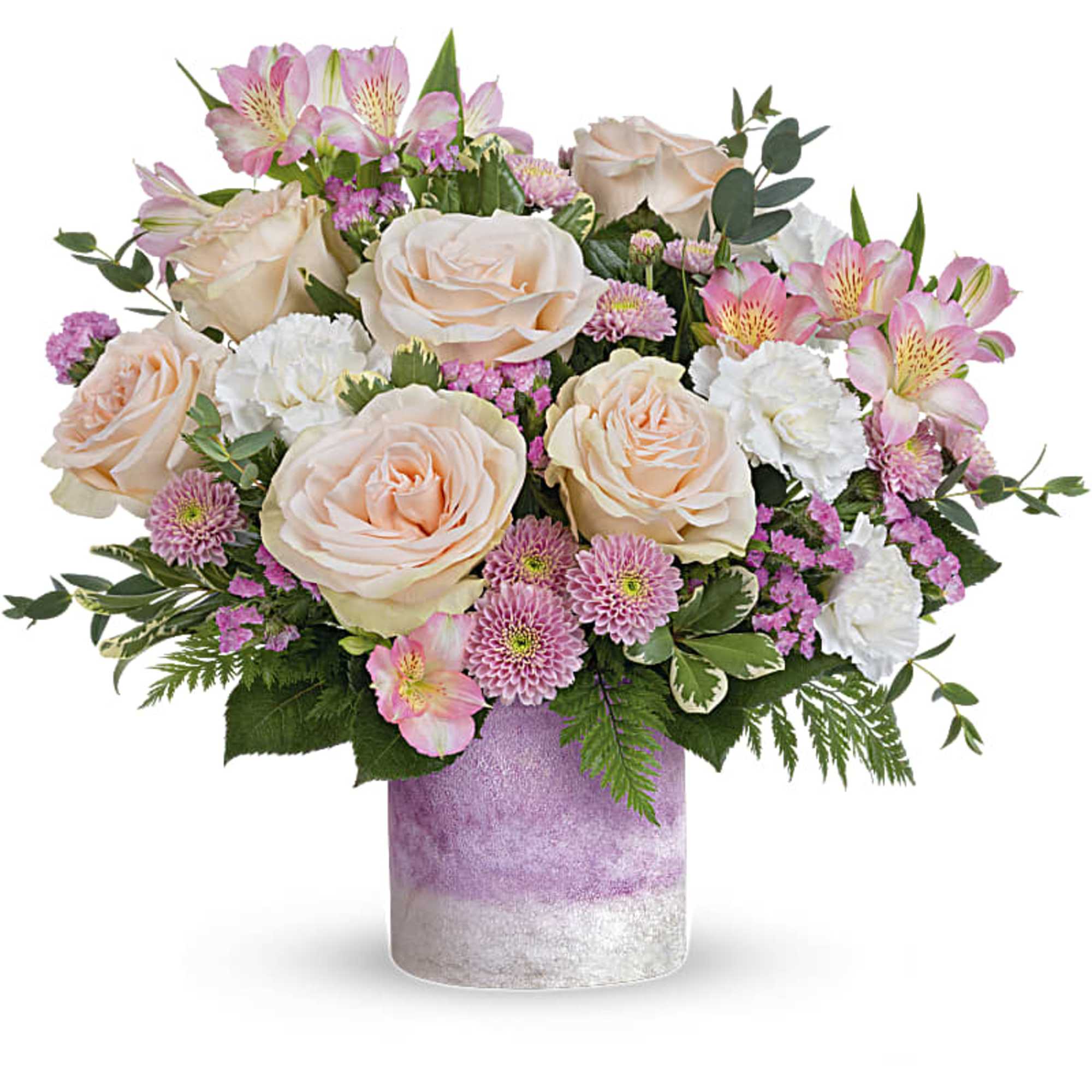 Pink and cream roses with mixed blooms in a lavender vase