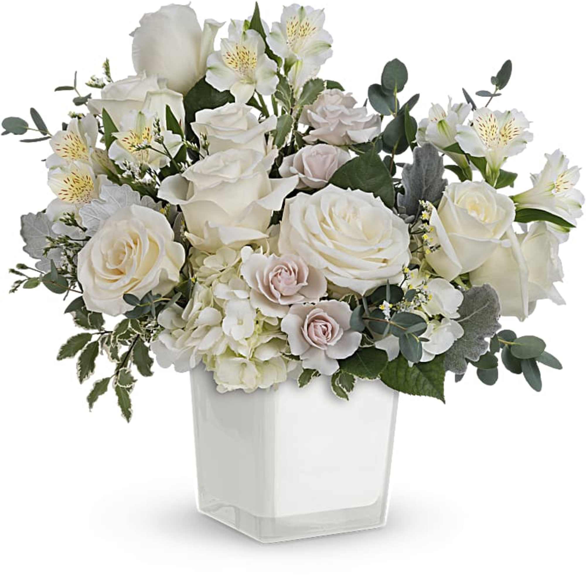 White roses and alstroemeria in a clear square vase