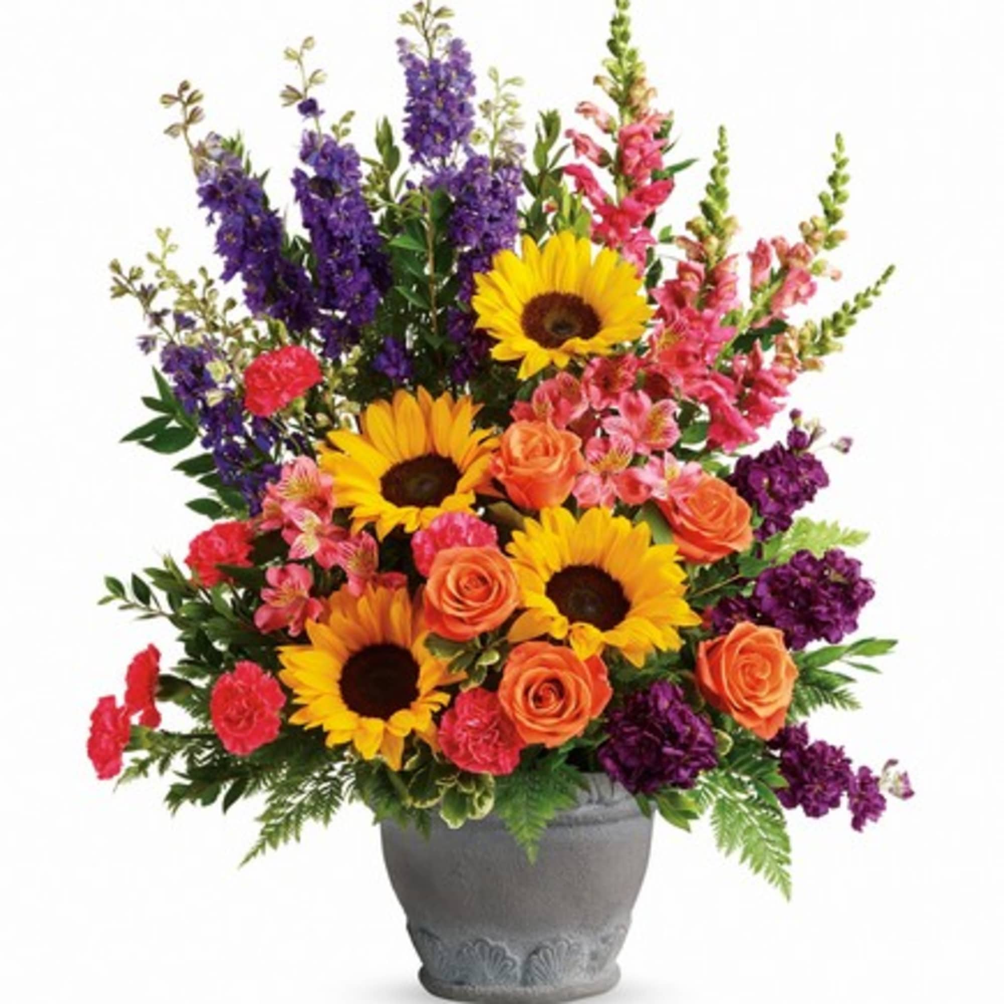 Colorful bouquet with sunflowers, roses, and purple blooms in a gray vase