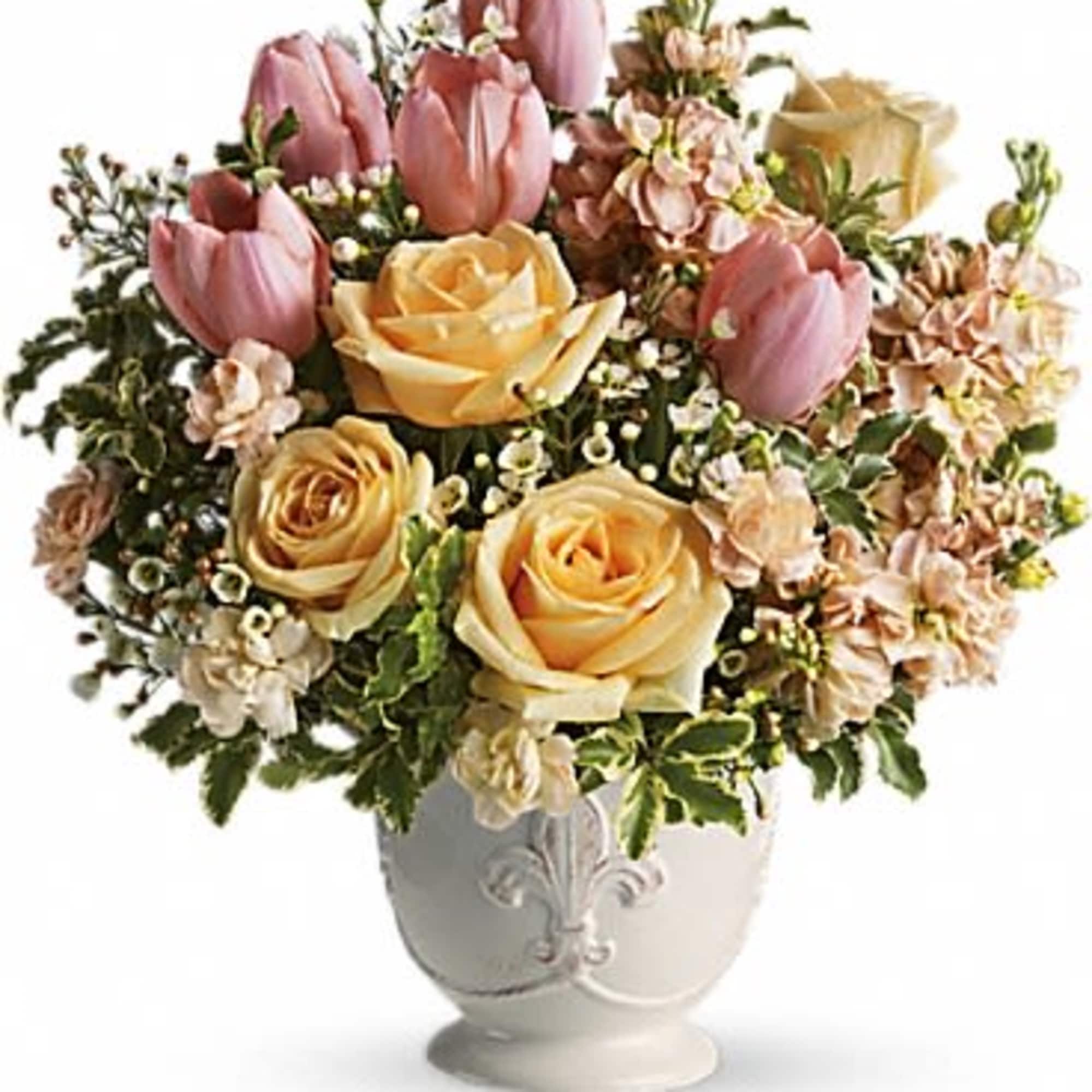 Pink tulips and yellow roses in a white vase