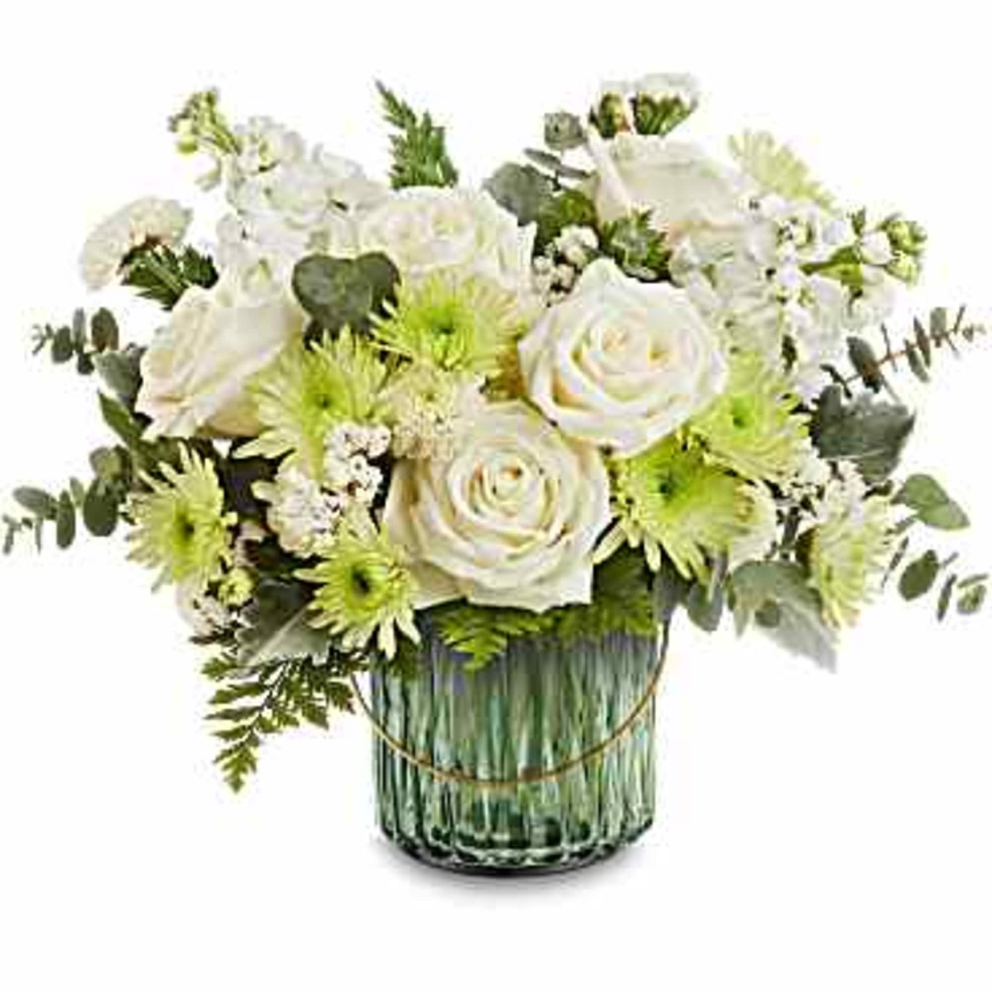 White roses and green chrysanthemums in a glass vase