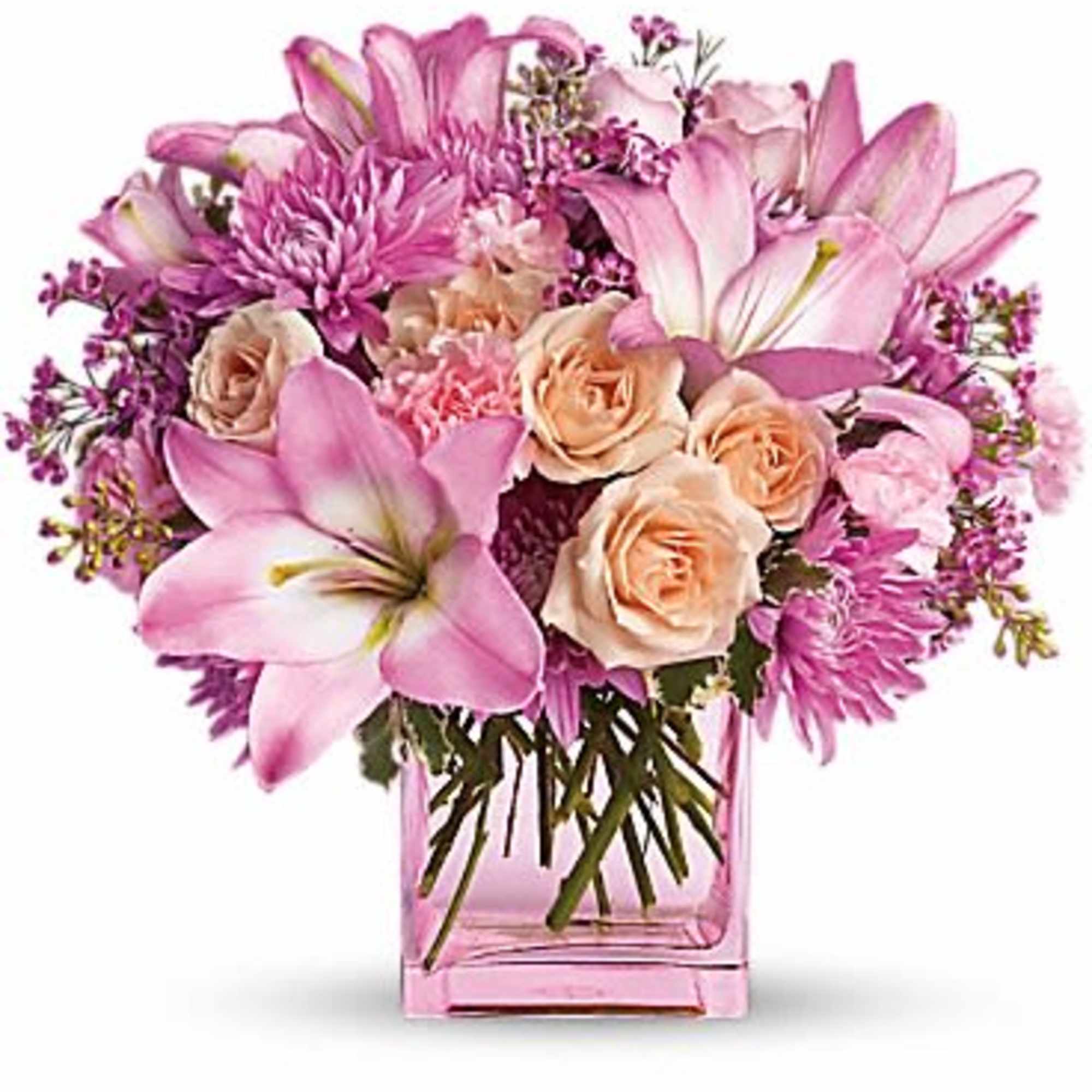 Pink lilies and roses arranged in a pink glass vase