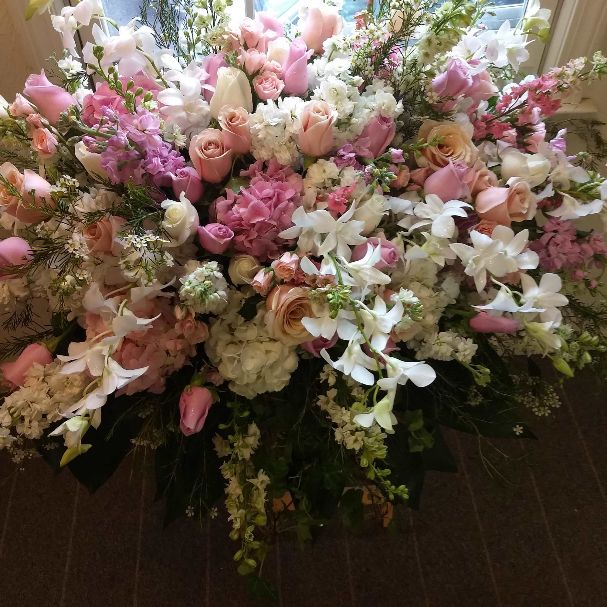A beautiful spray of soft pink, white and cr&Atilde;&uml;me blooms ease the, photo 2 of 2