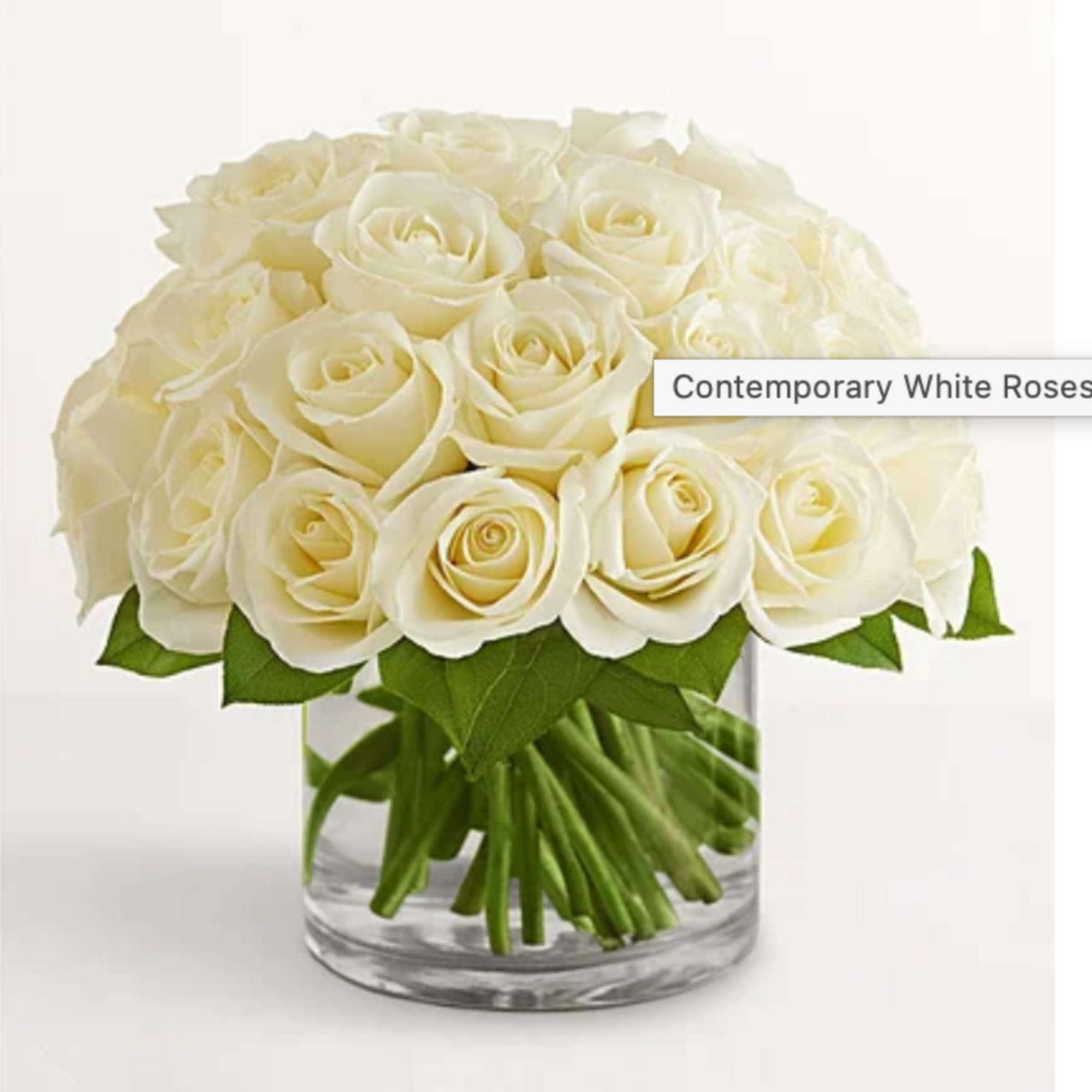 Bouquet of white roses in a clear glass vase