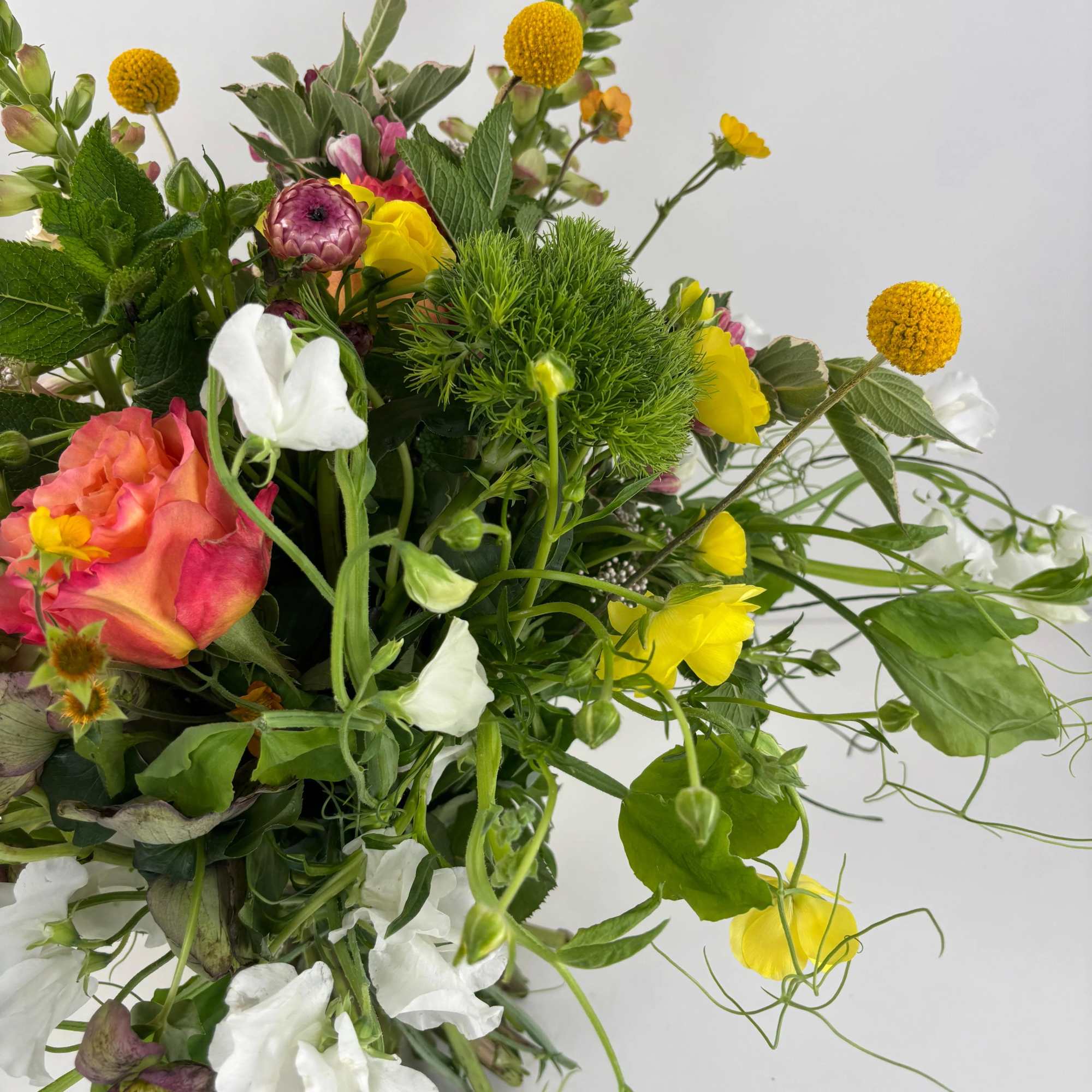 Mixed bouquet with yellow, white, pink, and orange flowers