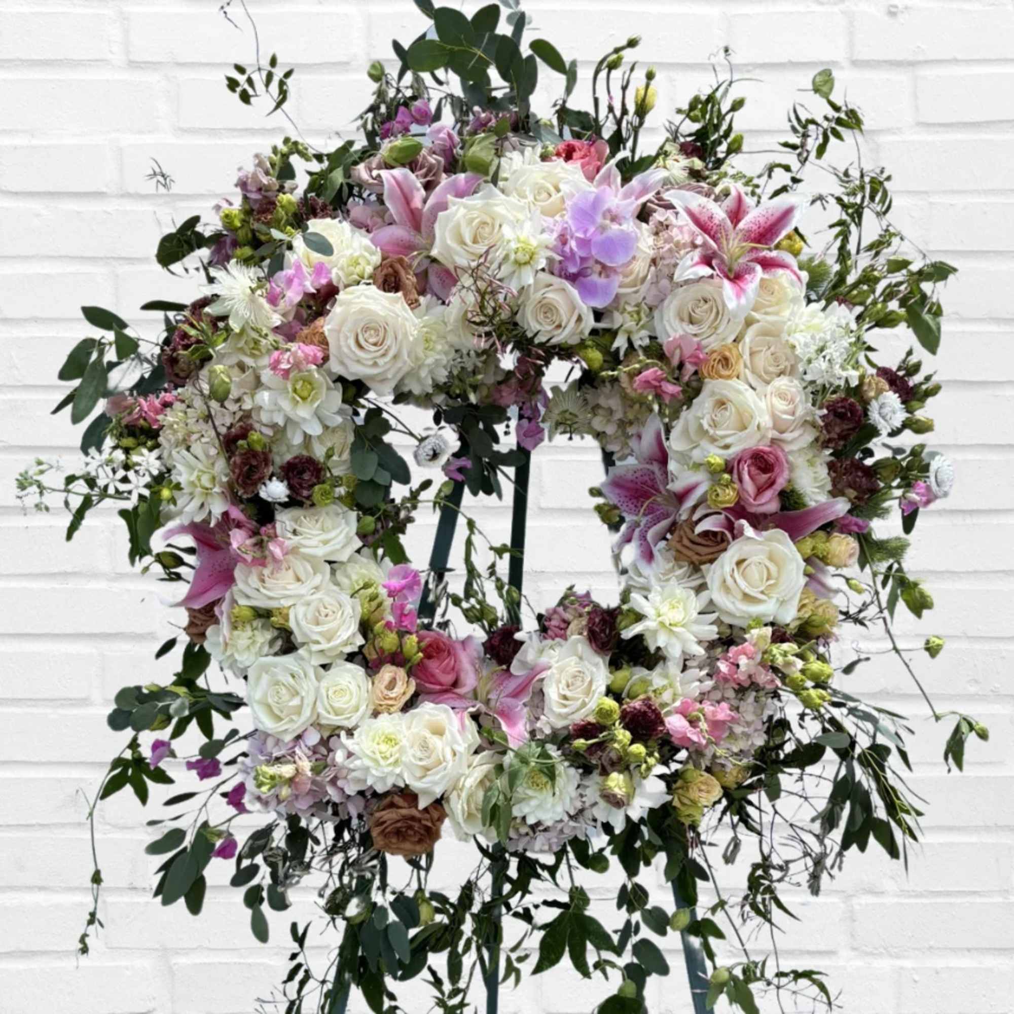 Large floral wreath with white and pink roses and lilies