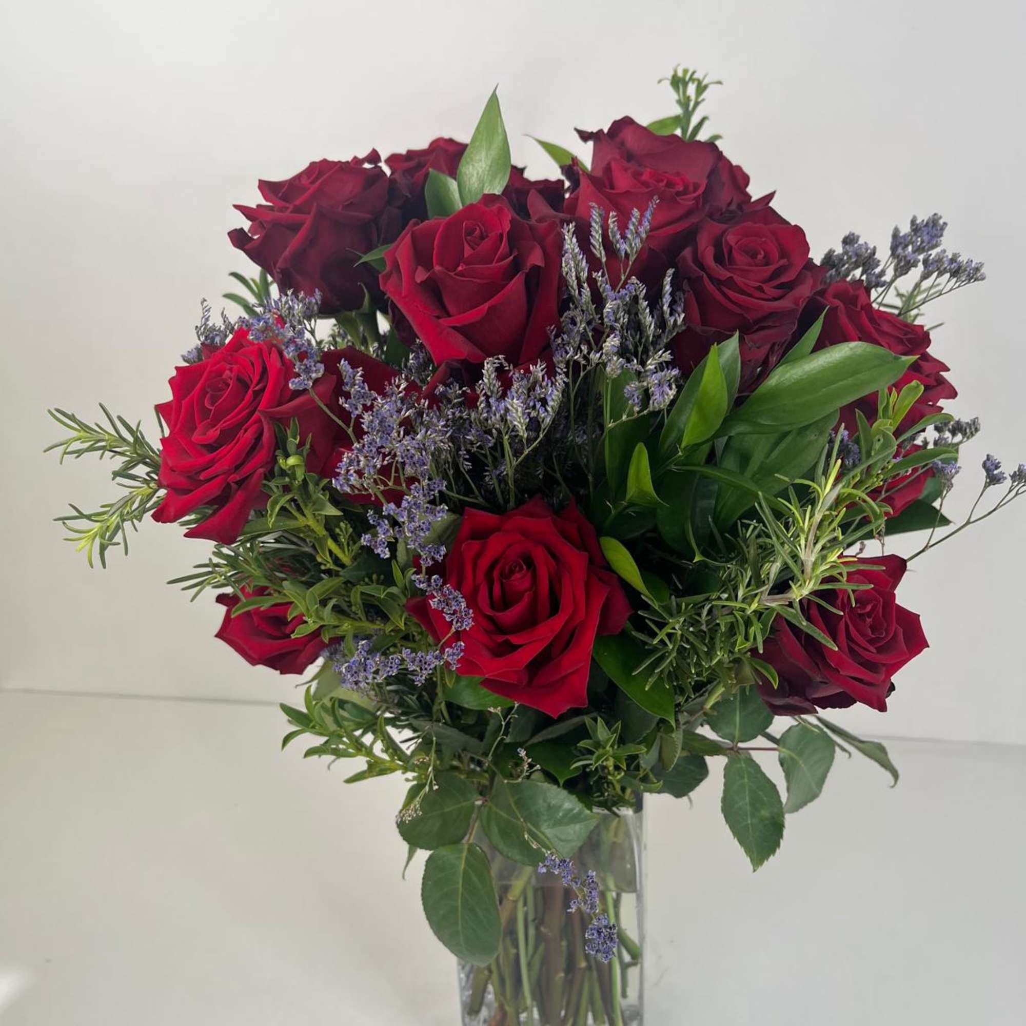 Bouquet of red roses in a clear glass vase