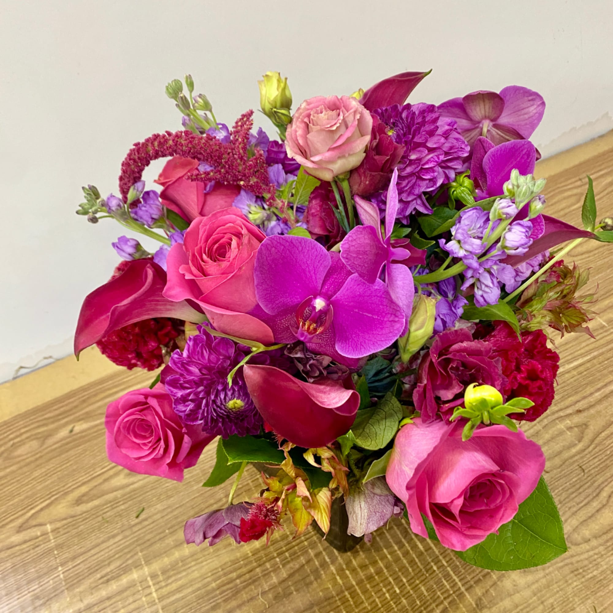Mixed bouquet of pink and purple flowers in a vase