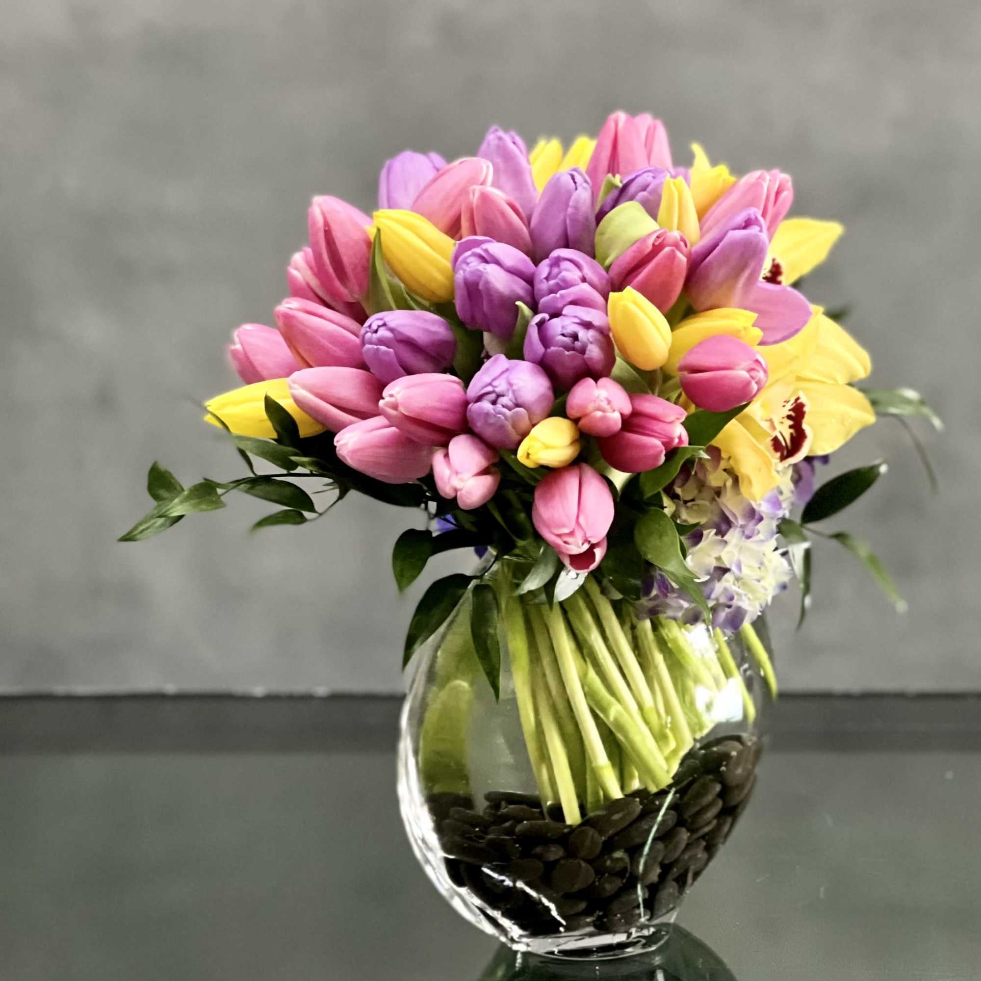 Here's a spring-tastic way to brighten someone's day: a glass vase of, photo 2 of 3