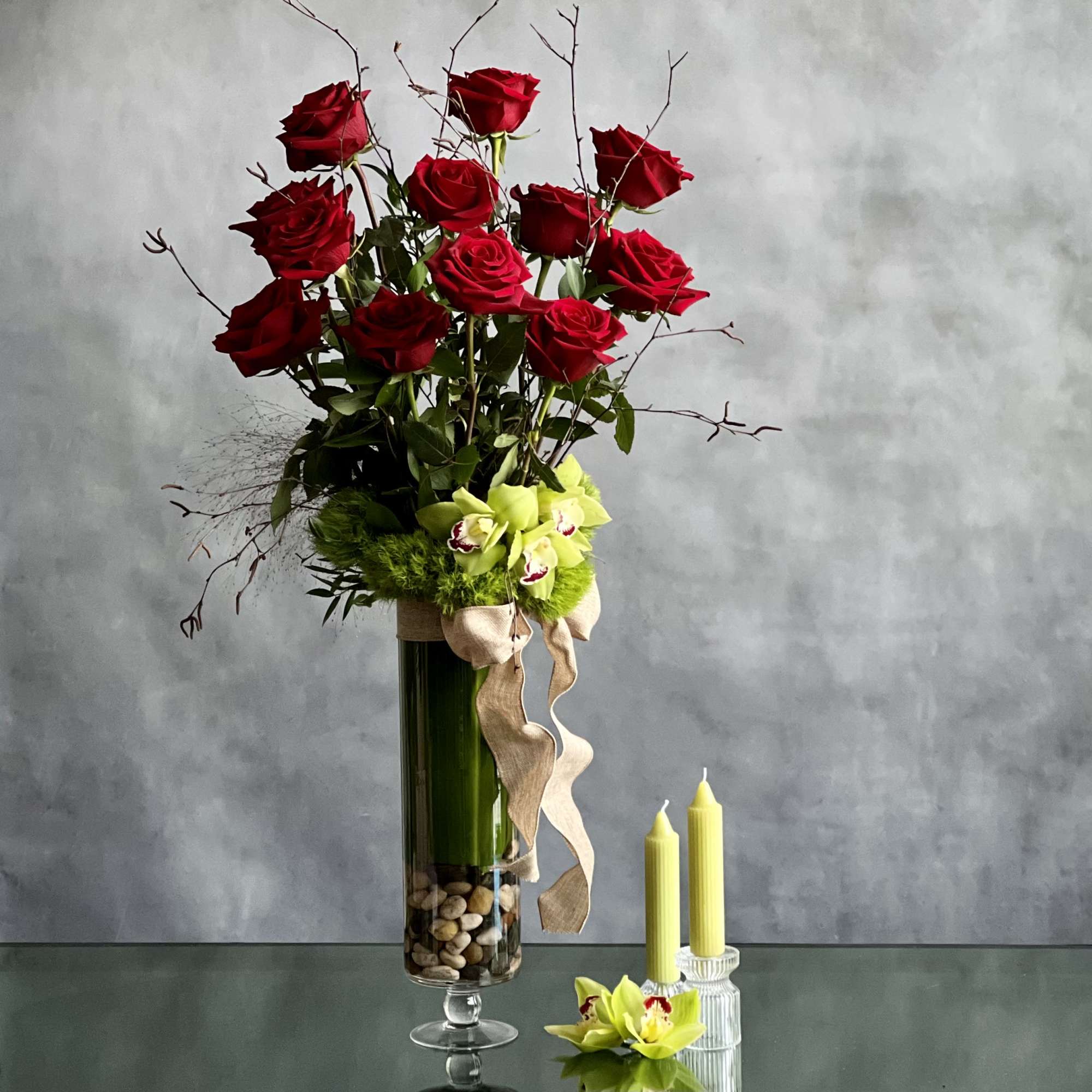 Simple elegance.... this lovely glass footed vase holds 1 dozen Imported Ecuadorian