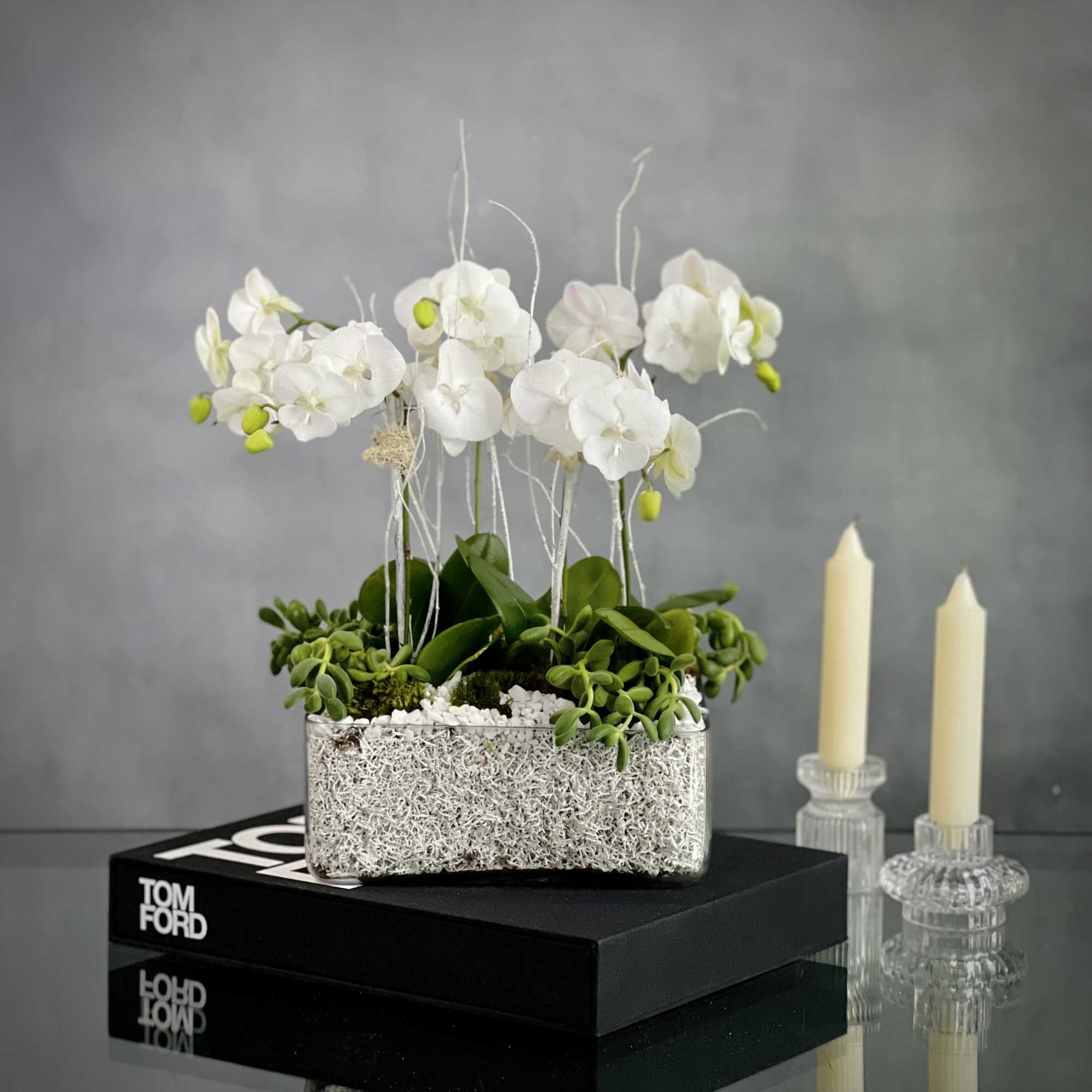 5 White Orchids in a Modern Low profile Square glass container decorated