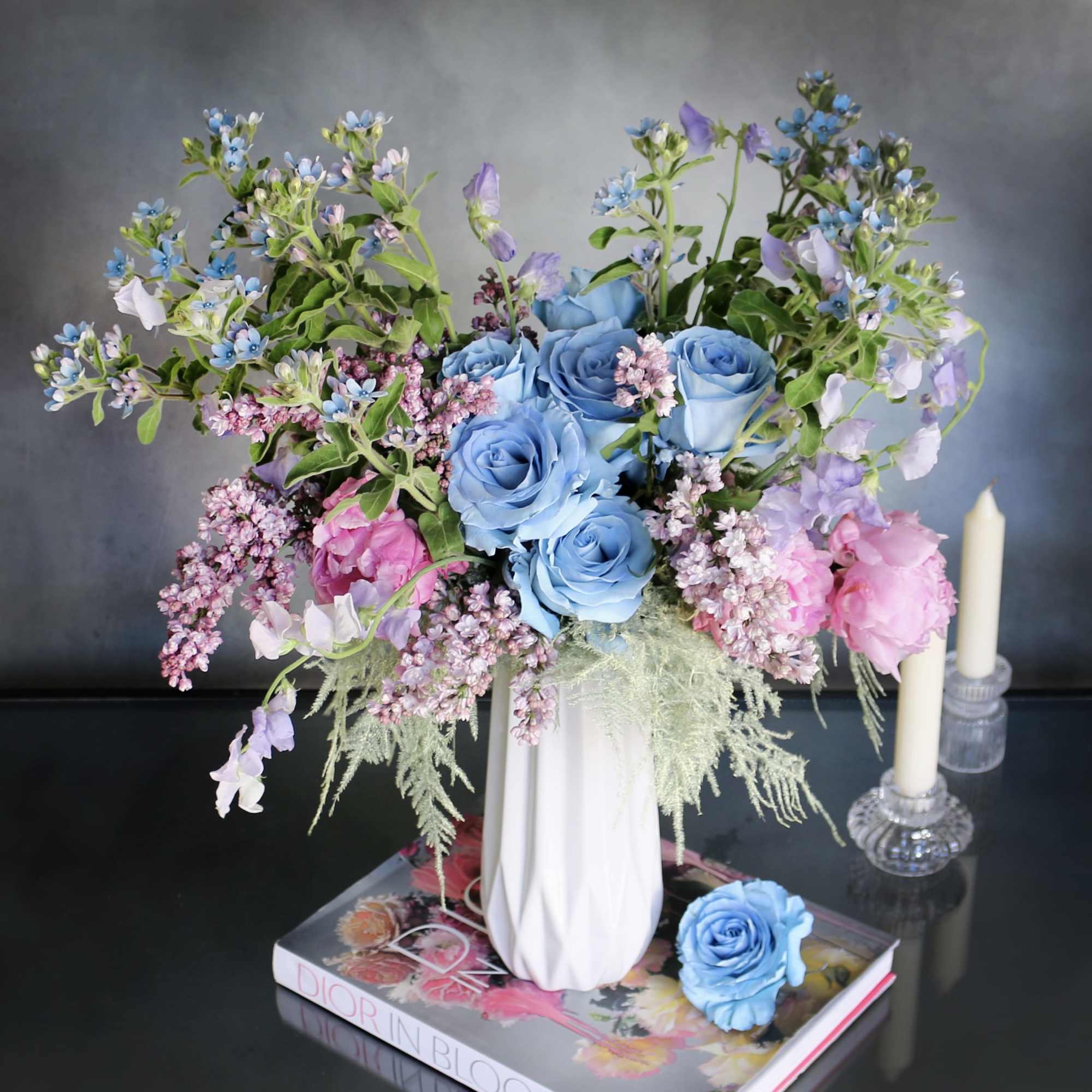 "By The Shore" consists of blue Roses, Peonies, Sweet Peas, Lilacs and