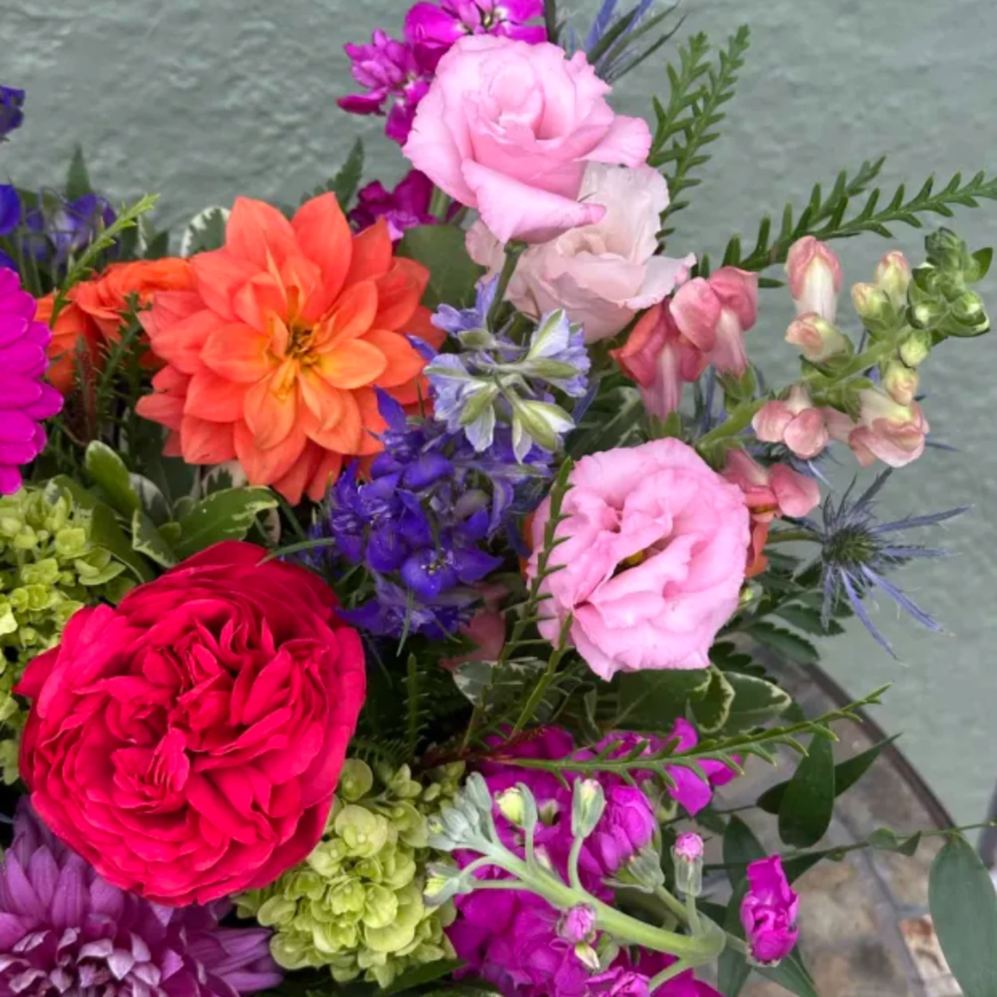 Colorful mixed bouquet with roses, dahlias, and lisianthus