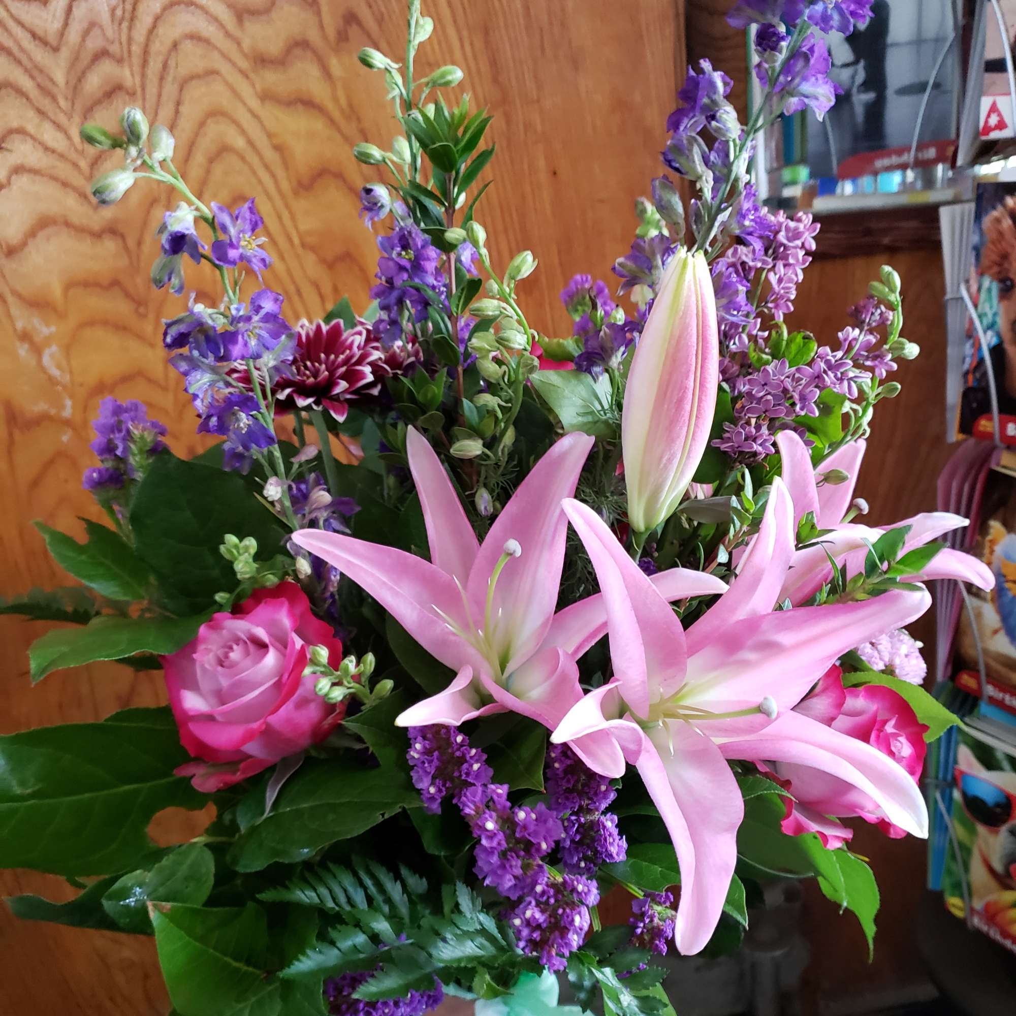 Bouquet of pink lilies, roses, and purple flowers