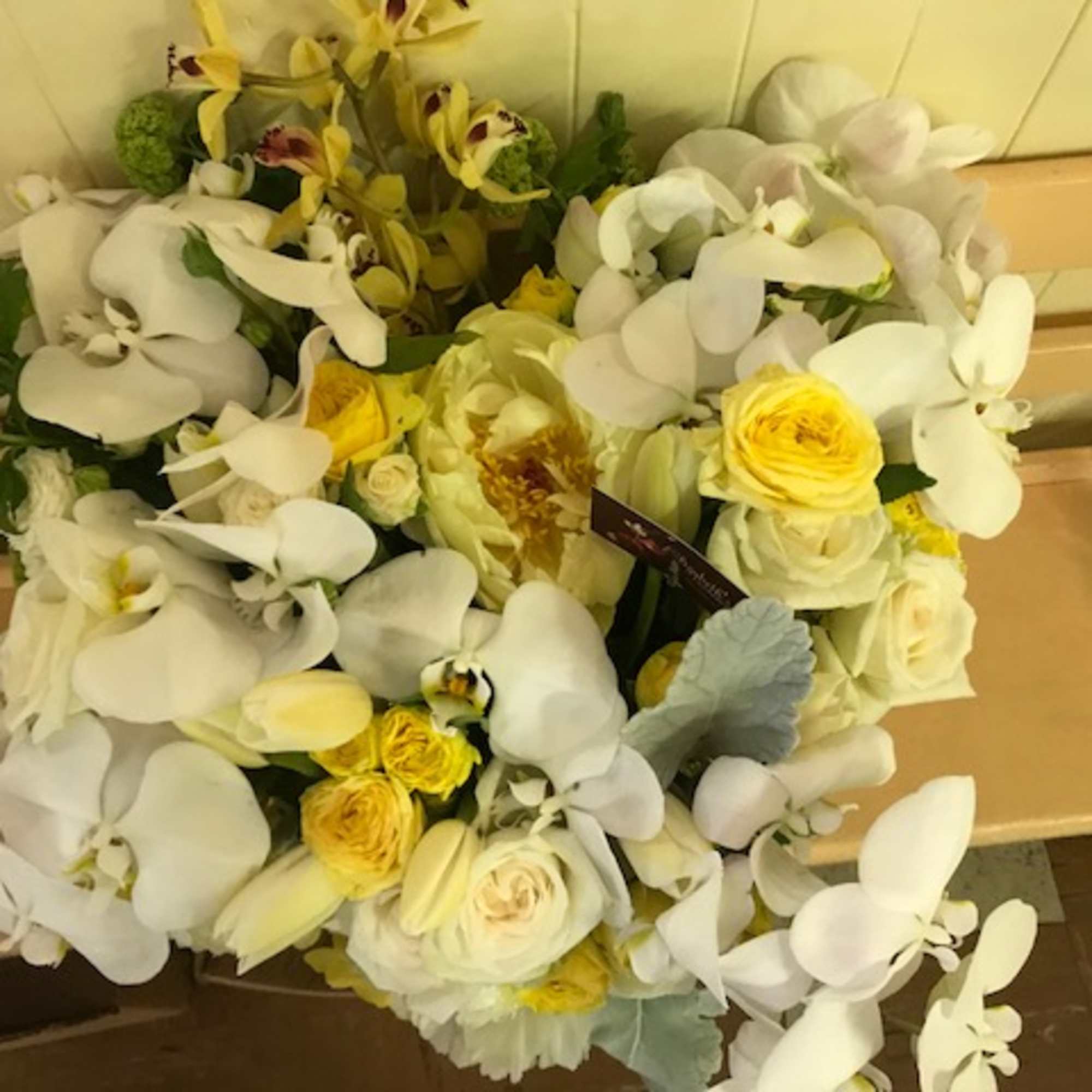Bouquet of white orchids and yellow roses