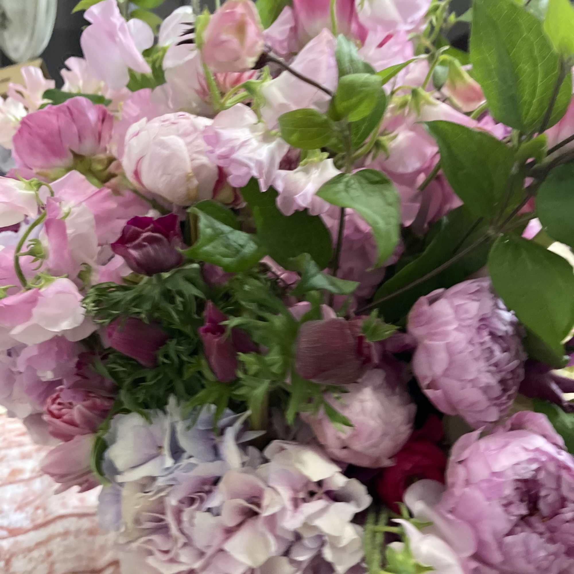 Pink and lavender bouquet with peonies and sweet peas
