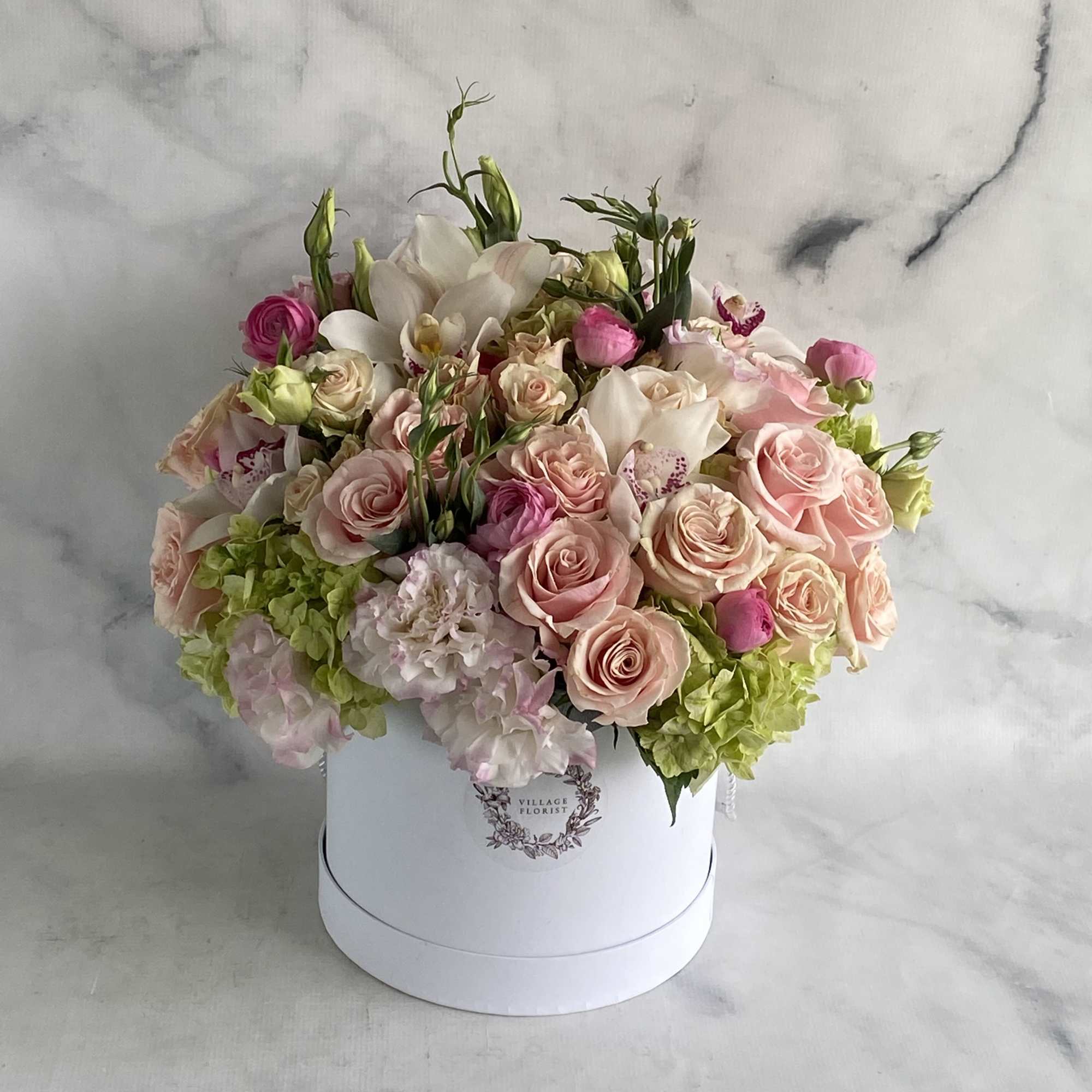 A hat box filled with spring flowers.  Roses, hydrangeas, tulips, lisianthus, photo 2 of 2
